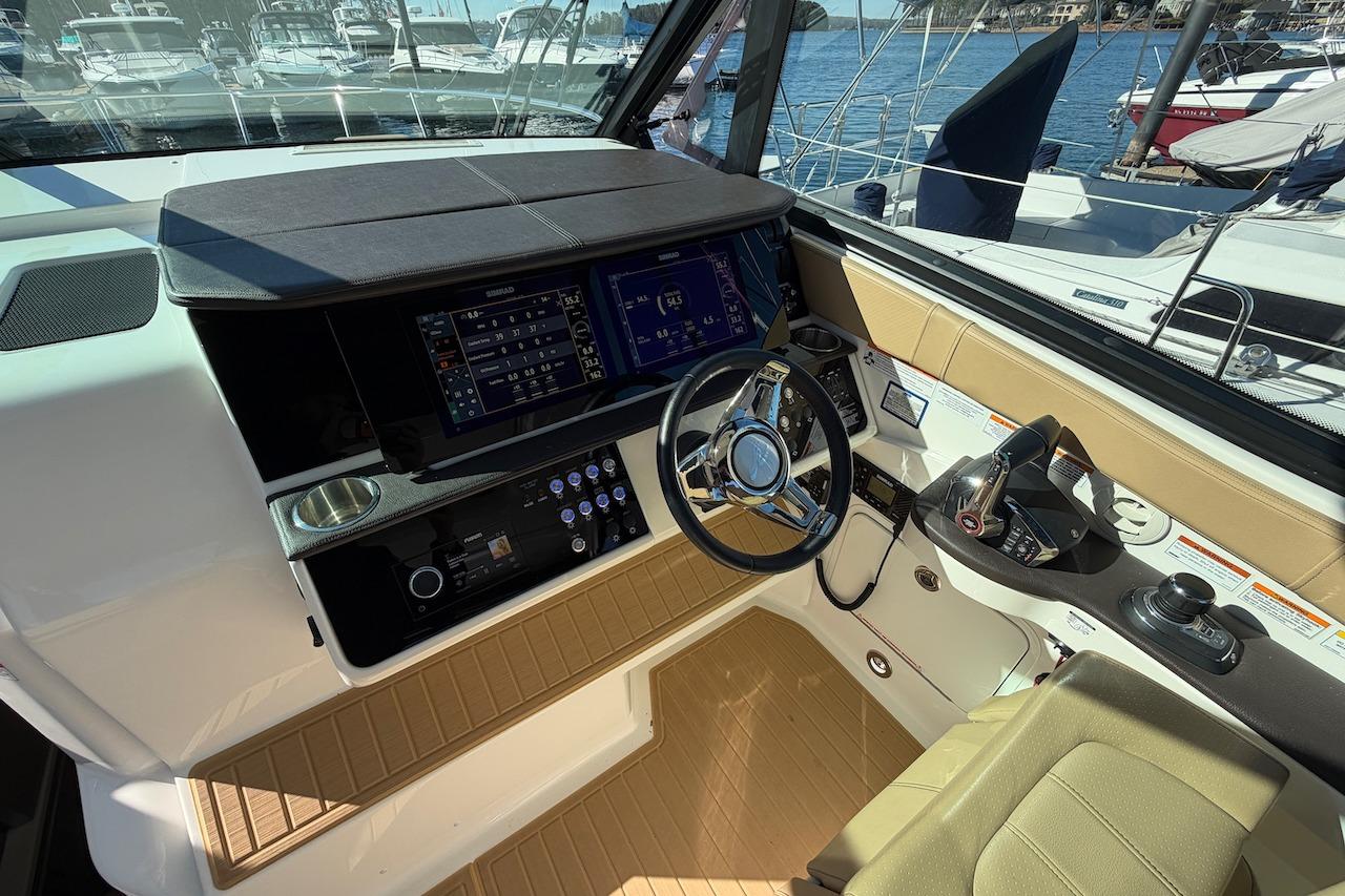 2023 Sea Ray Sundancer 320 Outboard helm with modern controls and navigation displays.