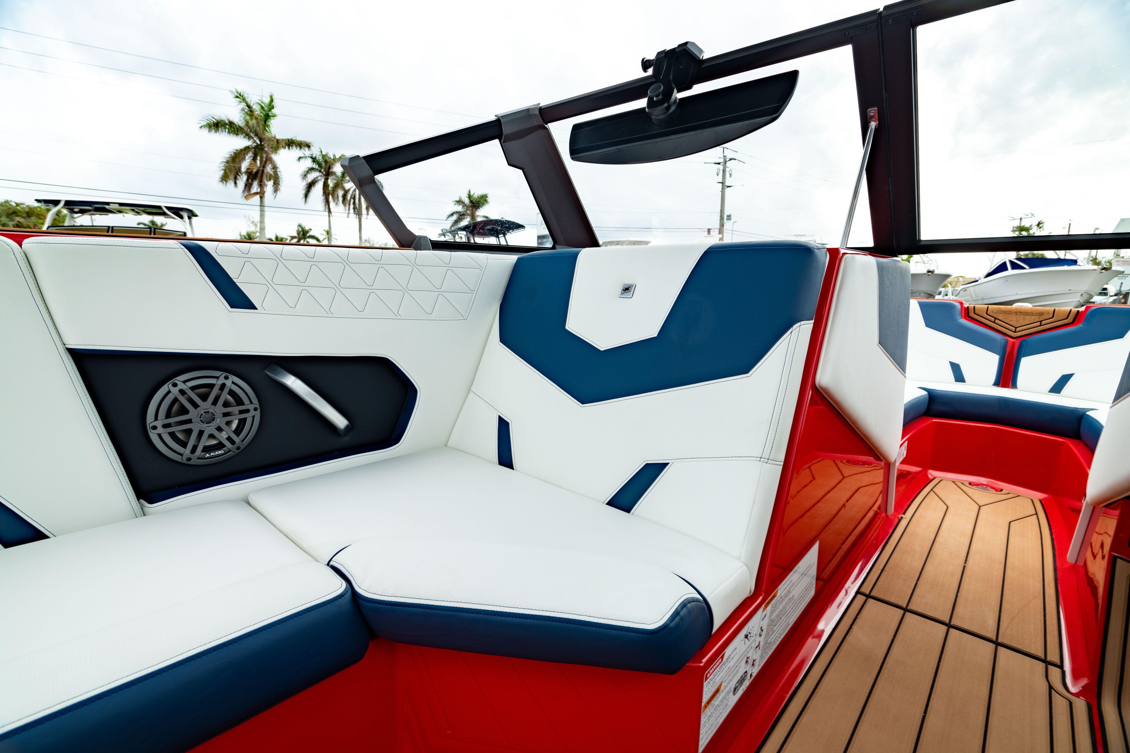 2025 Nautique Super Air Nautique GS20 interior with red, white, and blue seating.