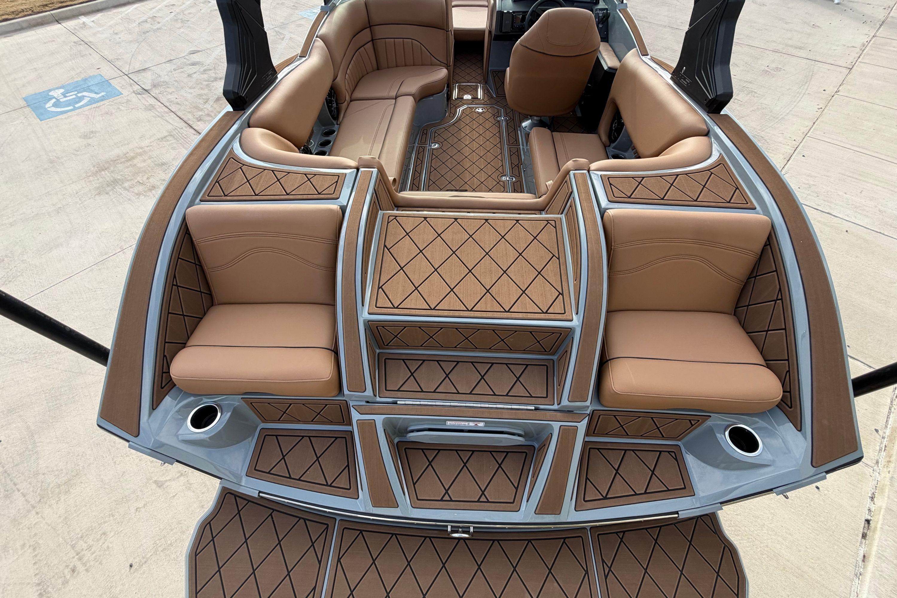 Luxurious interior of 2026 MB B52 21 Alpha boat with brown leather seating.