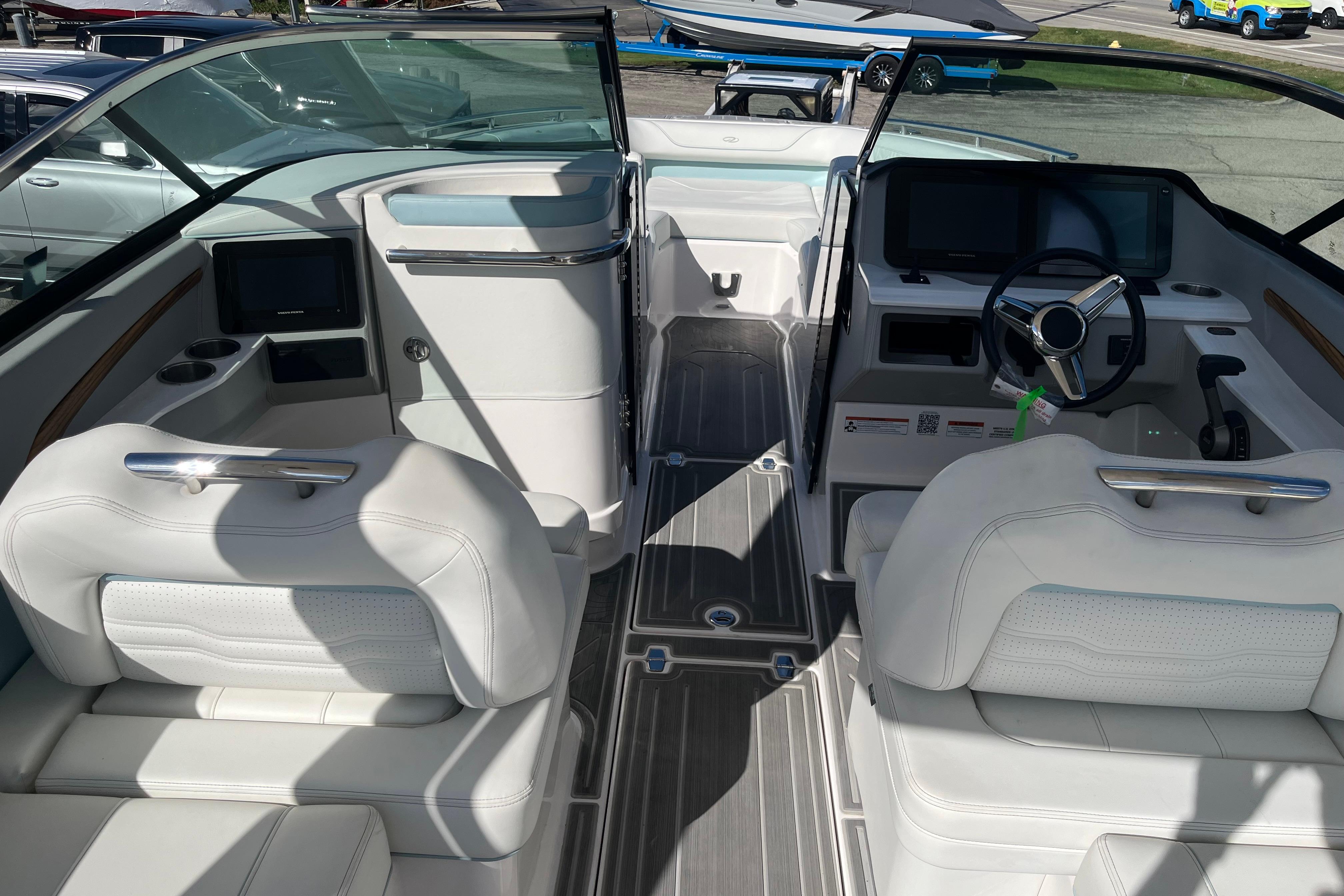 2024 Regal LS9 Surf boat interior with white seating and modern dashboard design.