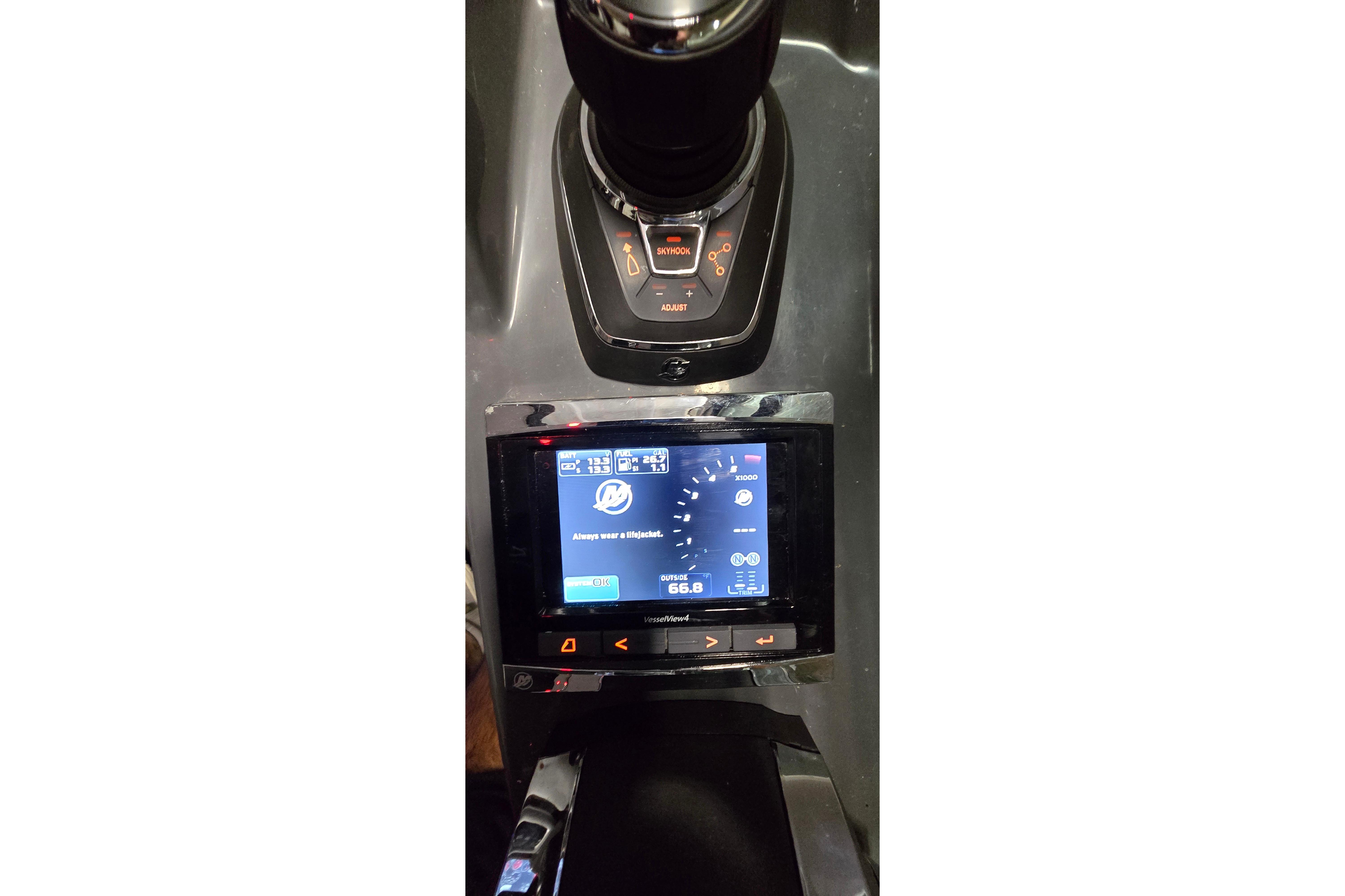 Control panel of 2018 Four Winns V355 boat with digital display and controls.
