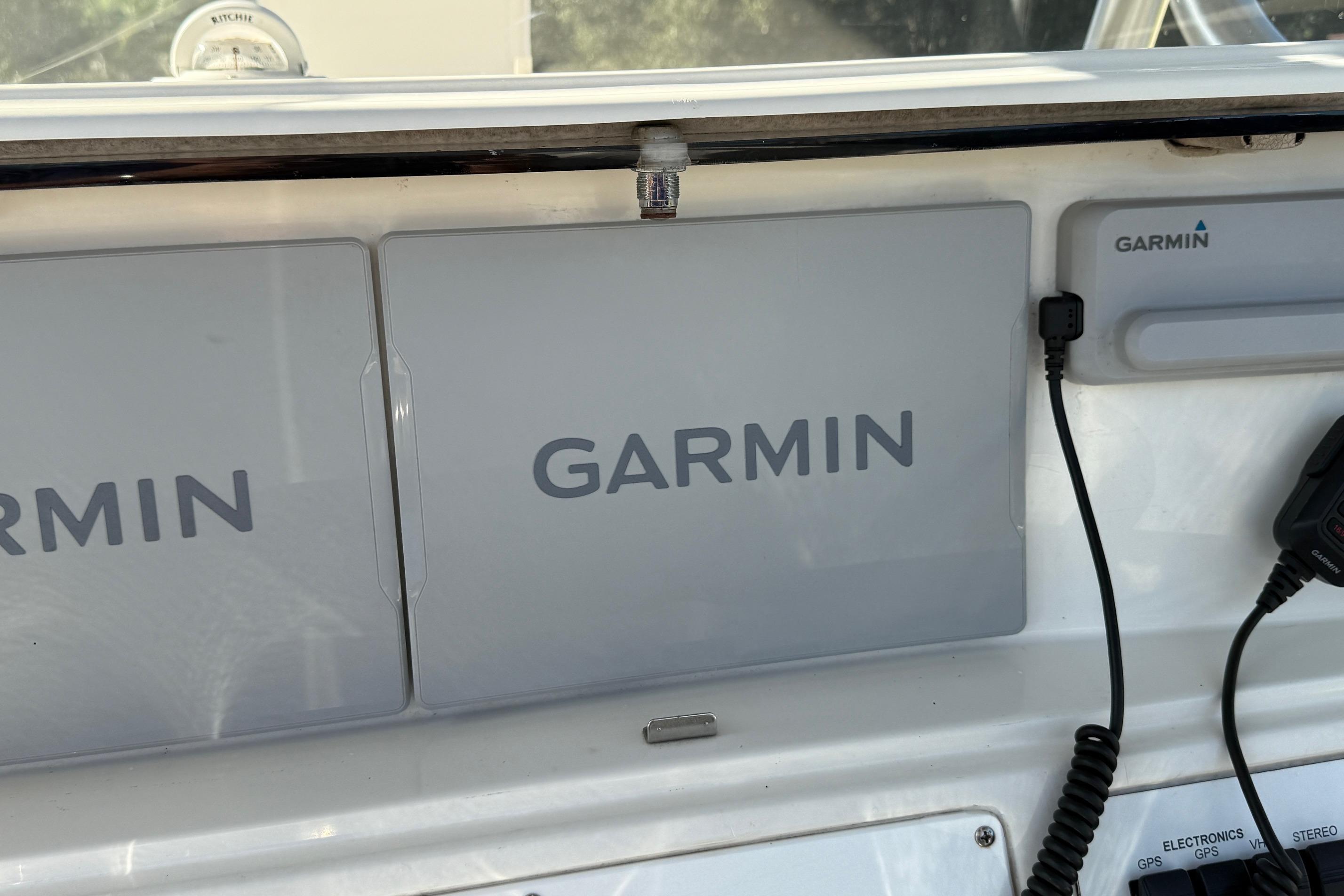 Garmin navigation system on 2001 Marlago 35 Cuddy boat dashboard.