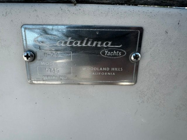 Metal plaque with "Catalina Yachts" and model number on a white background.
