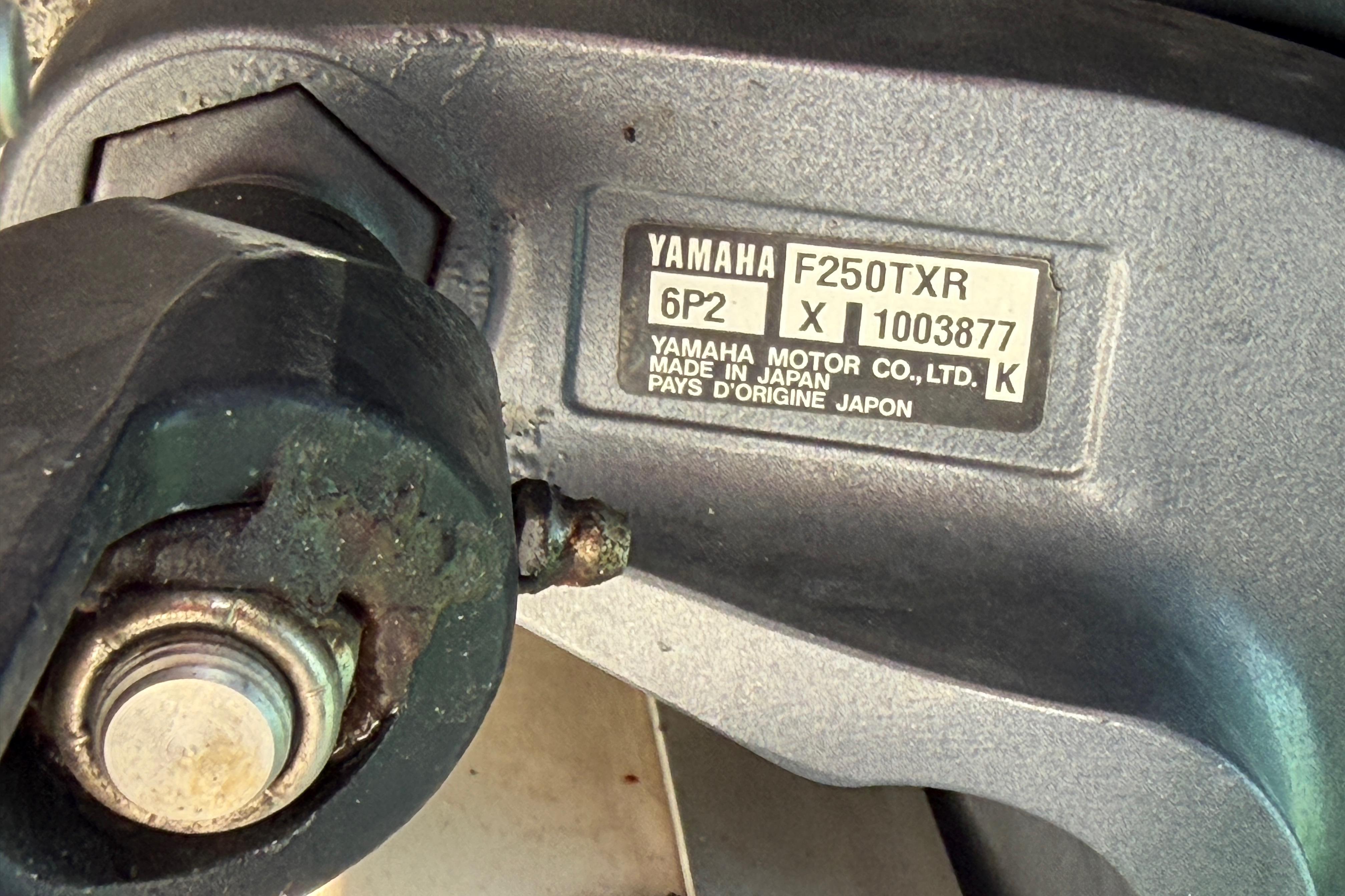 Yamaha F250TXR engine label on 2006 Grady-White Sailfish 282 boat, showing model details.