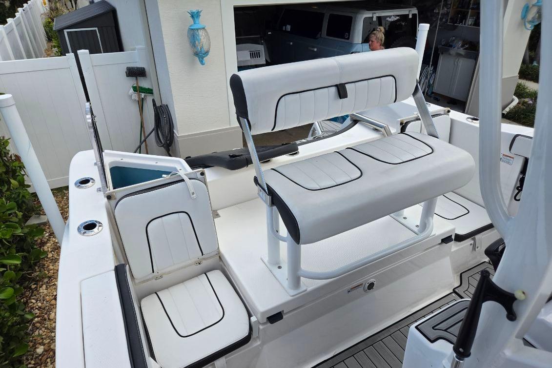 2024 Yamaha Boats 222 FSH Sport E interior with white seating and sleek design.