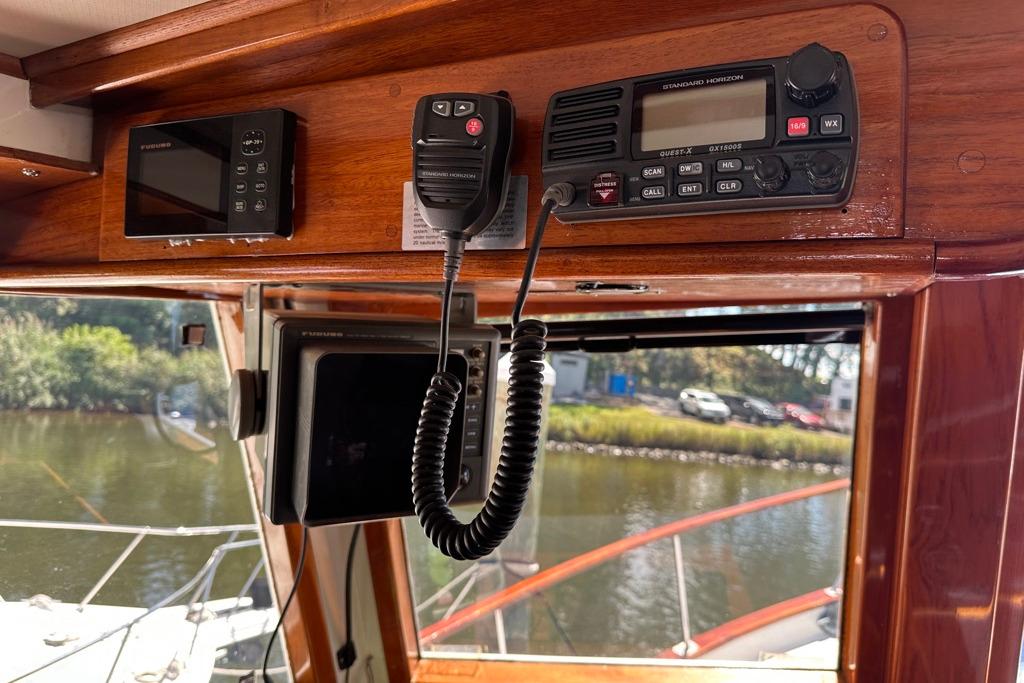 1983 Kadey-Krogen Krogen 42 Trawler interior with navigation equipment and radio controls.