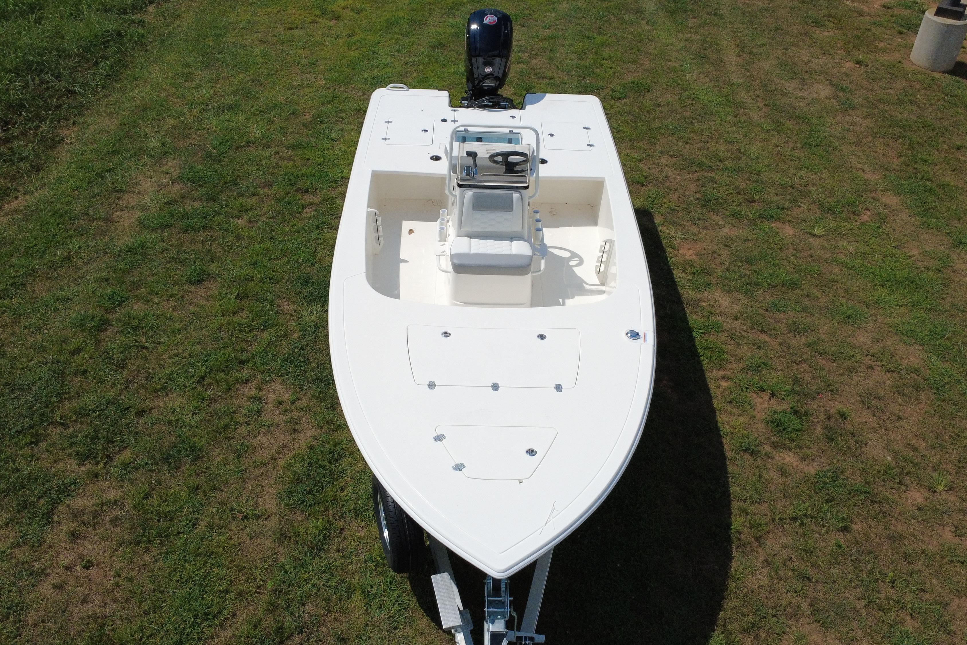 2026 Mako 18 Pro Skiff boat on grass, aerial view.