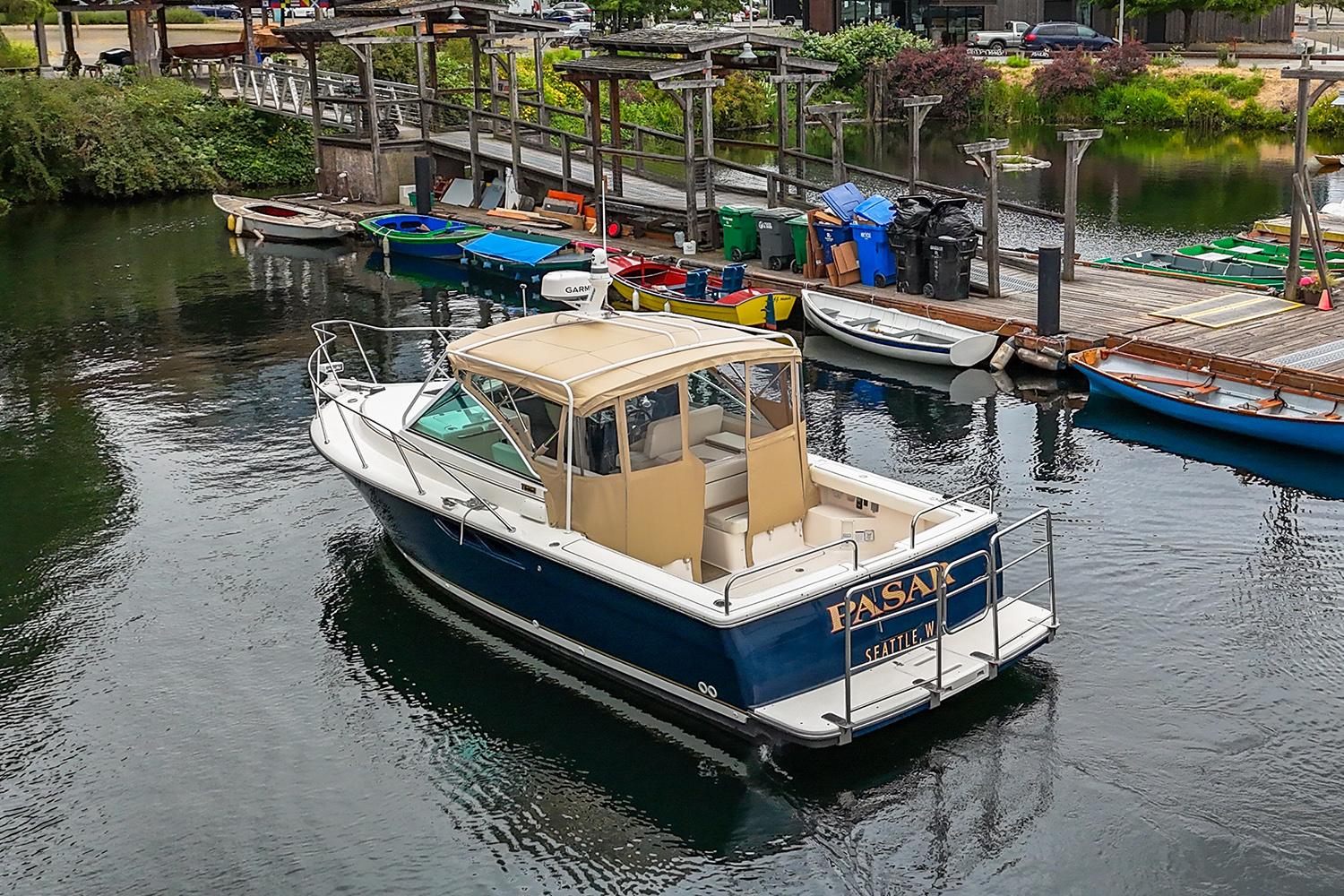 2006 Tiara Yachts 2900 Coronet docked at a marina with surrounding boats.