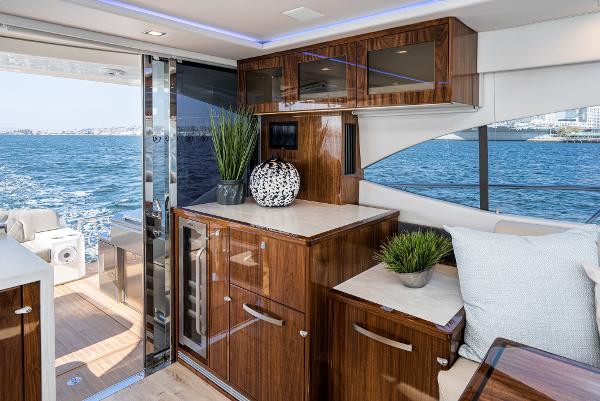 Luxurious interior of 2021 Riviera 5400 Sport Yacht with ocean view.