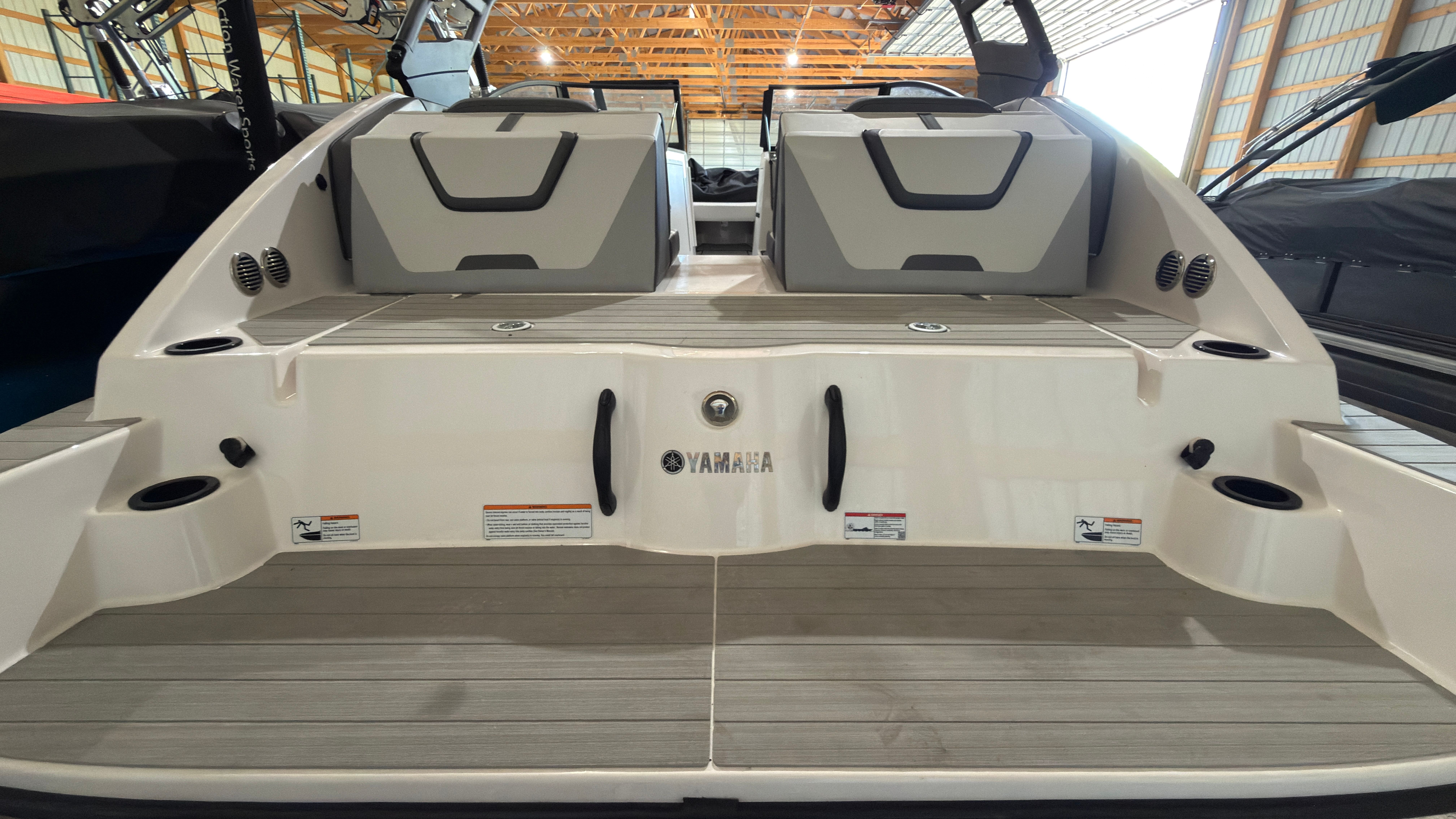 2024 Yamaha Boats AR220 rear view in warehouse.