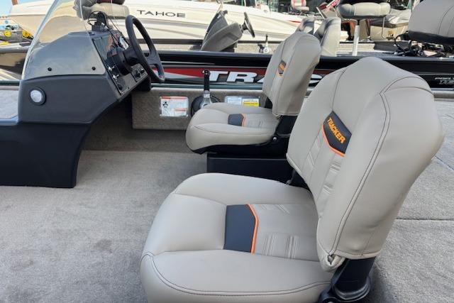 2026 Tracker Bass Tracker Classic Limited boat interior with beige seats and steering console.