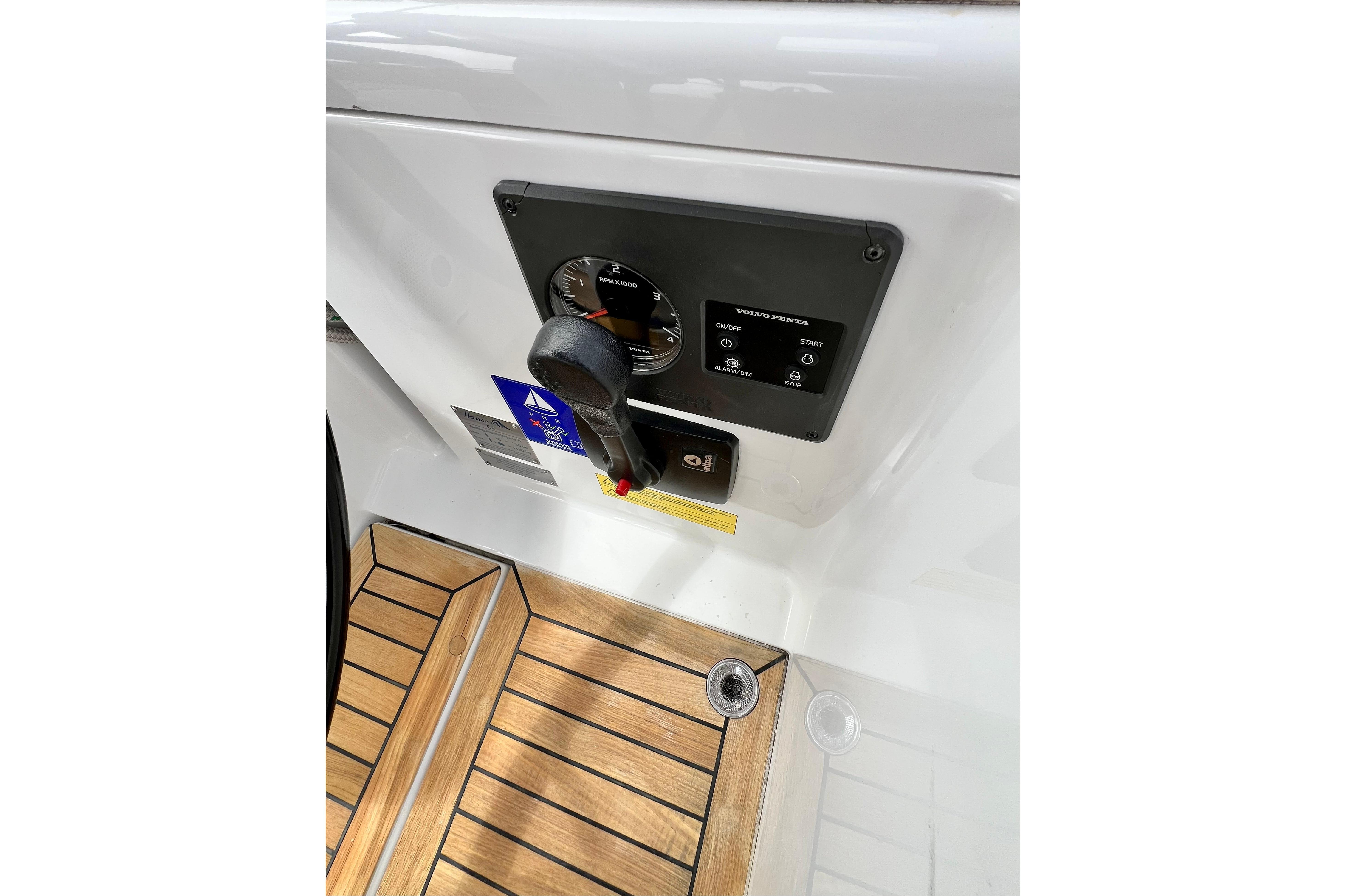 Control panel of a 2016 Hanse 455 yacht with wooden flooring.