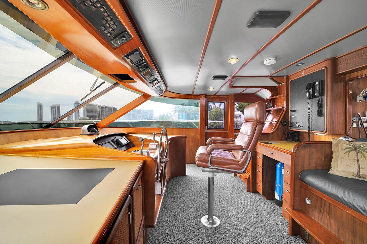 Luxurious interior of 1991 Jones-Goodell Yachtfish with leather seating and modern navigation equipment.