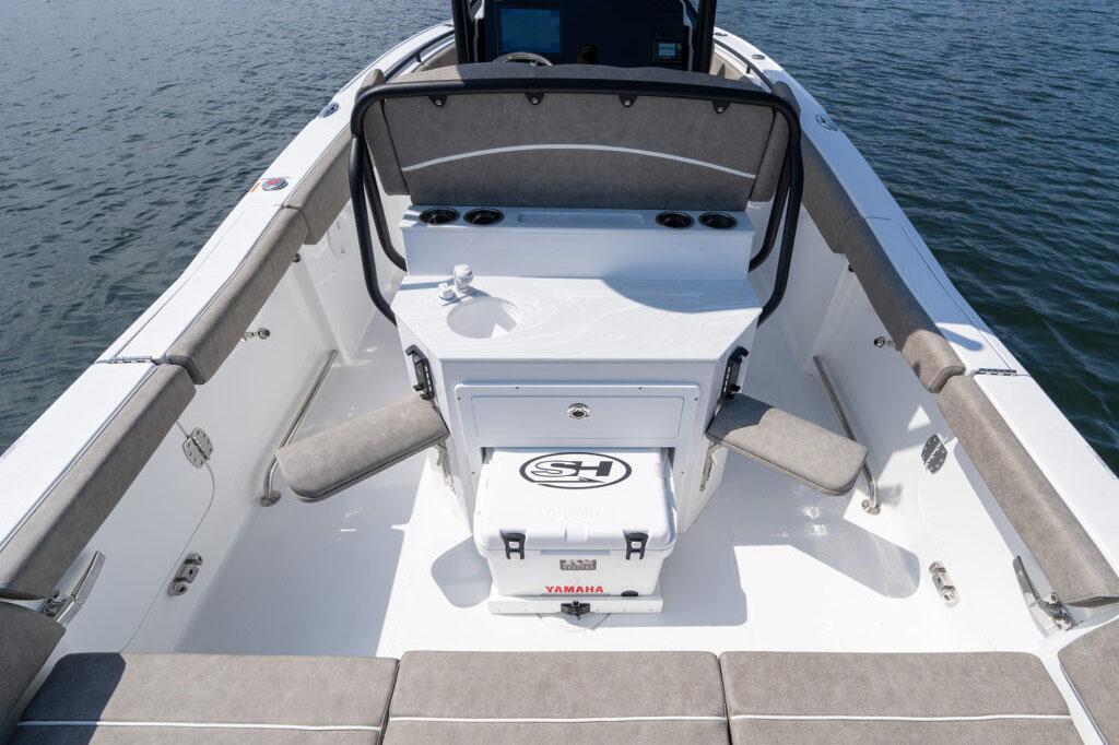 Manufacturer Provided Image: 2026 Sea Hunt Ultra 255 SE boat interior with seating and console on water.