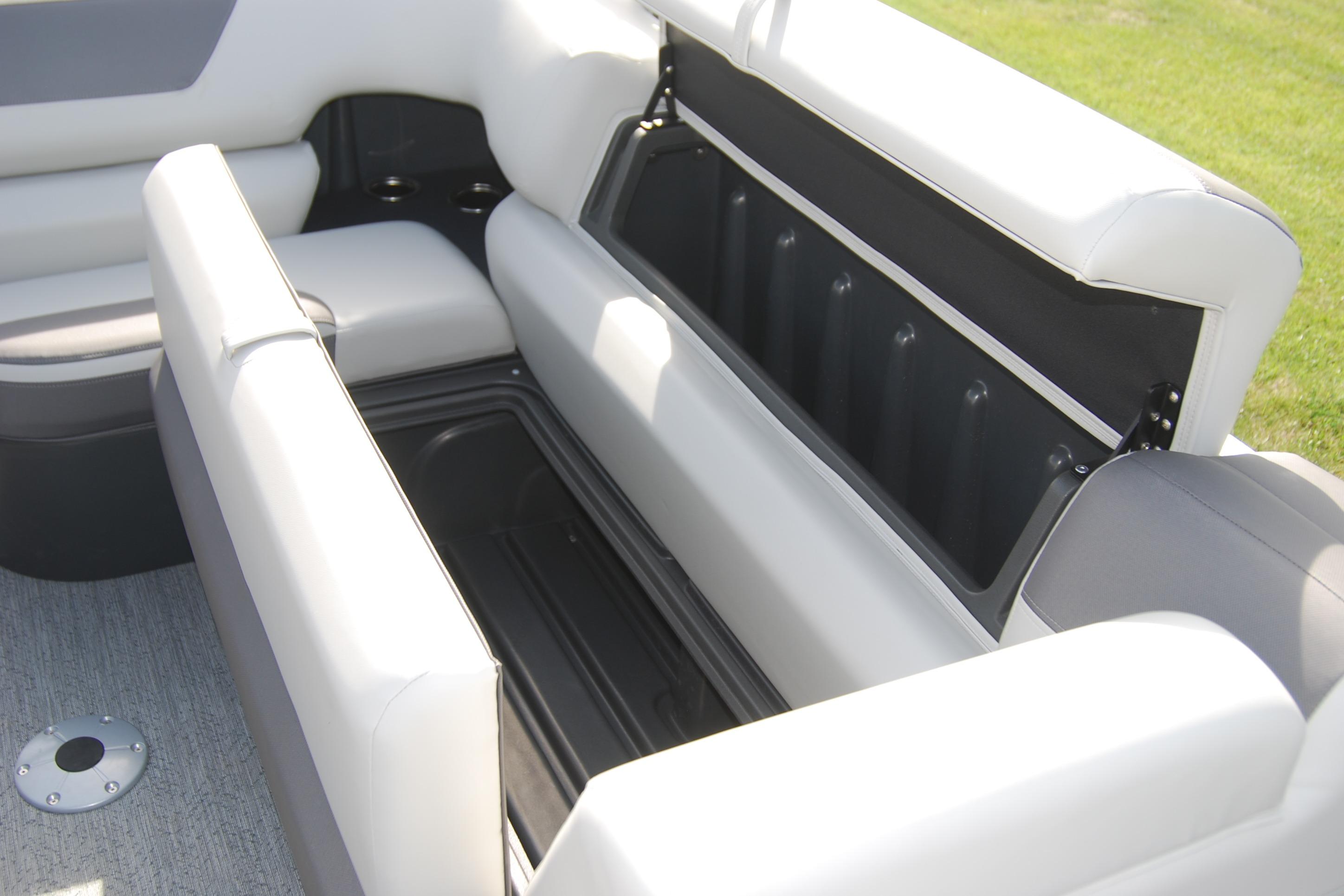 2026 Sun Tracker Fishin' Barge 22 XP3 interior storage compartment, open and spacious.