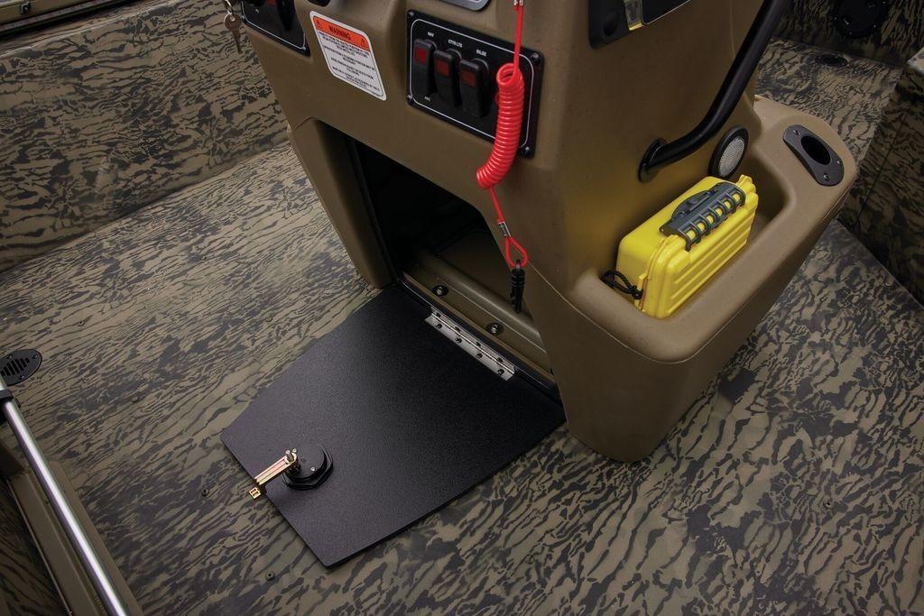 2026 Tracker GRIZZLY® 2072 CC Sportsman boat interior with storage compartment and safety equipment.