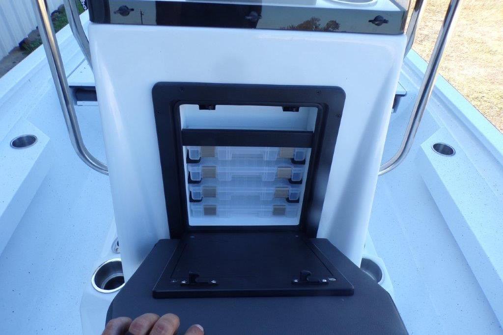 2026 Xpress H20B Bay boat console with storage compartments and cup holders.