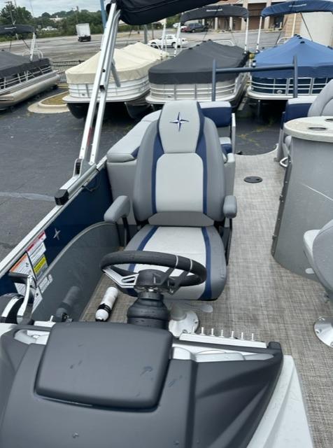 2023 Berkshire 24ULE-STS3 pontoon boat interior with steering console and seating.