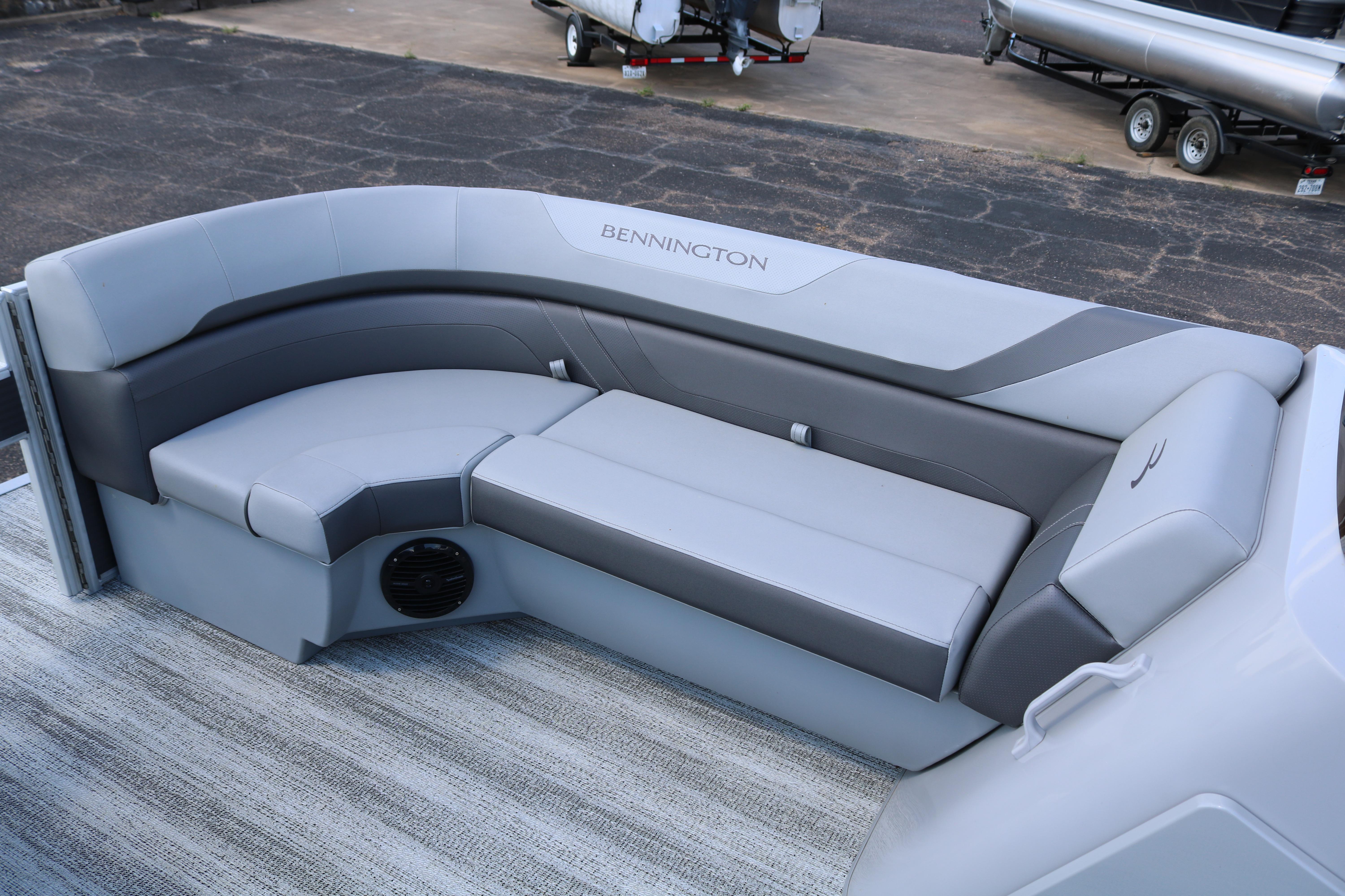 2026 Bennington 20SXSNP REAR FISH boat interior with gray seating and speaker.