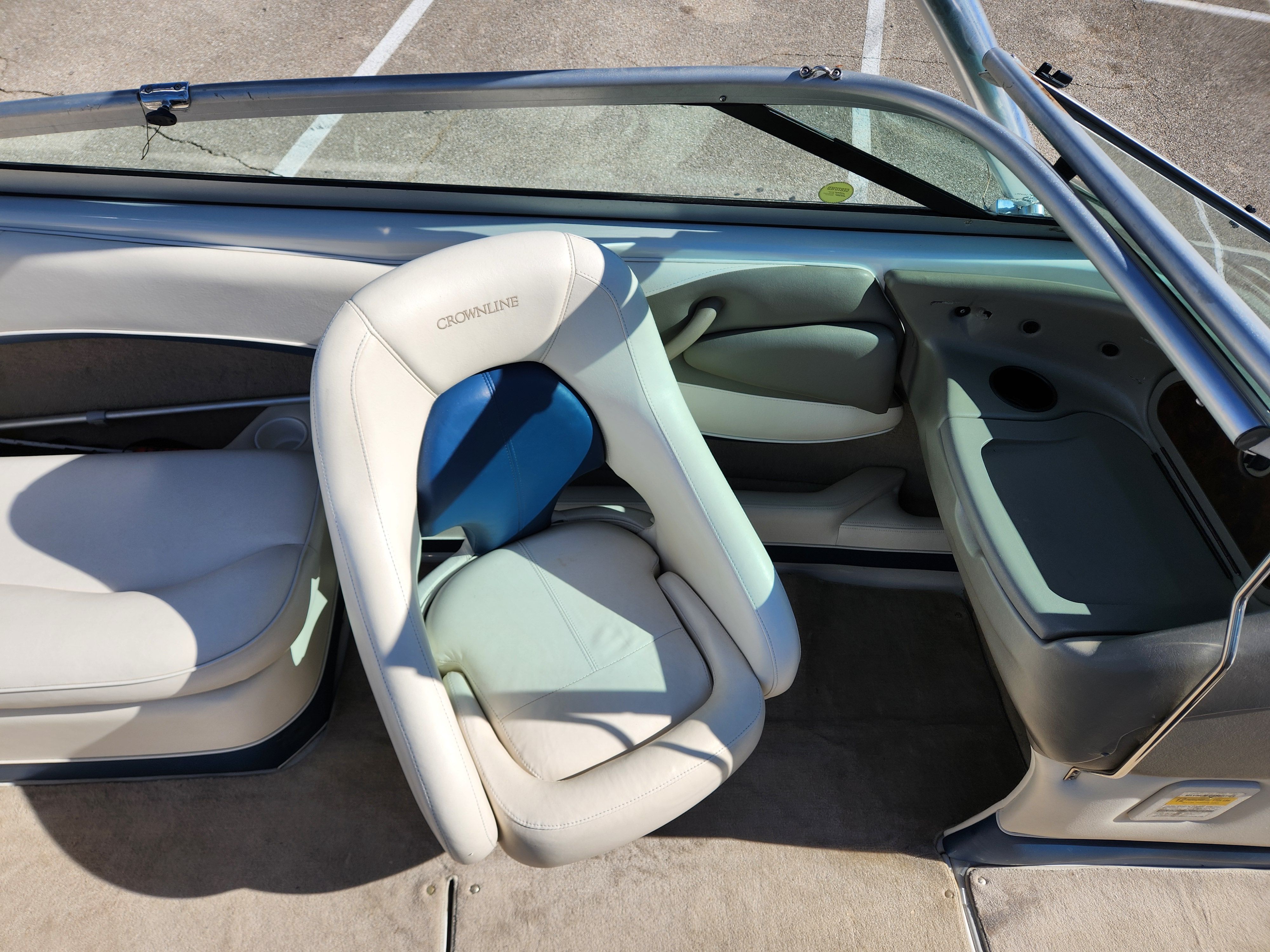 Interior of a 2003 Crownline 225 BR boat with beige seating.
