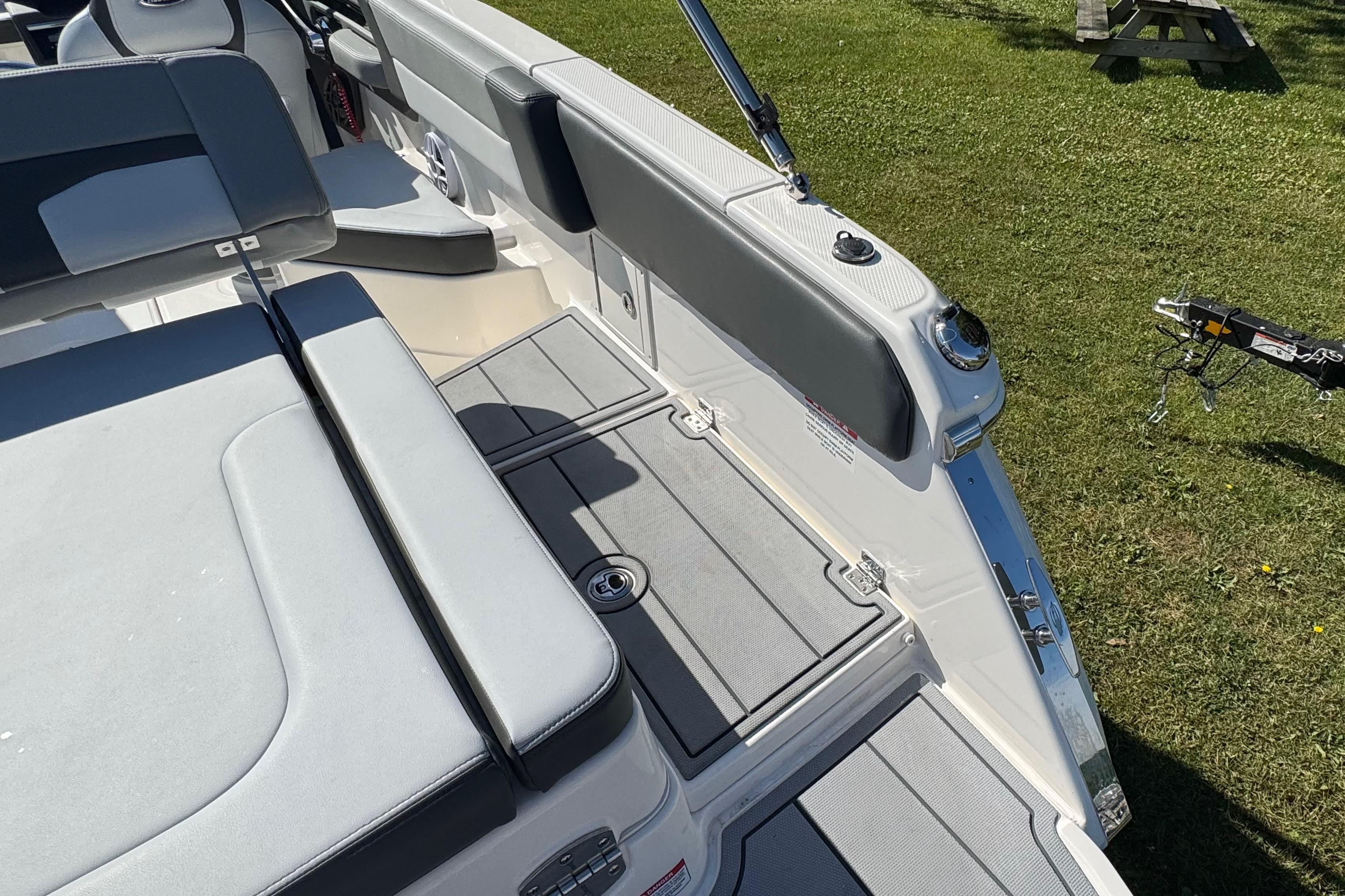 2026 Chaparral SSX 4 boat interior with sleek seating and modern design on grass.