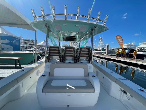 2025 Mag Bay 43 Center Console boat at a marina, showcasing seating and helm station.