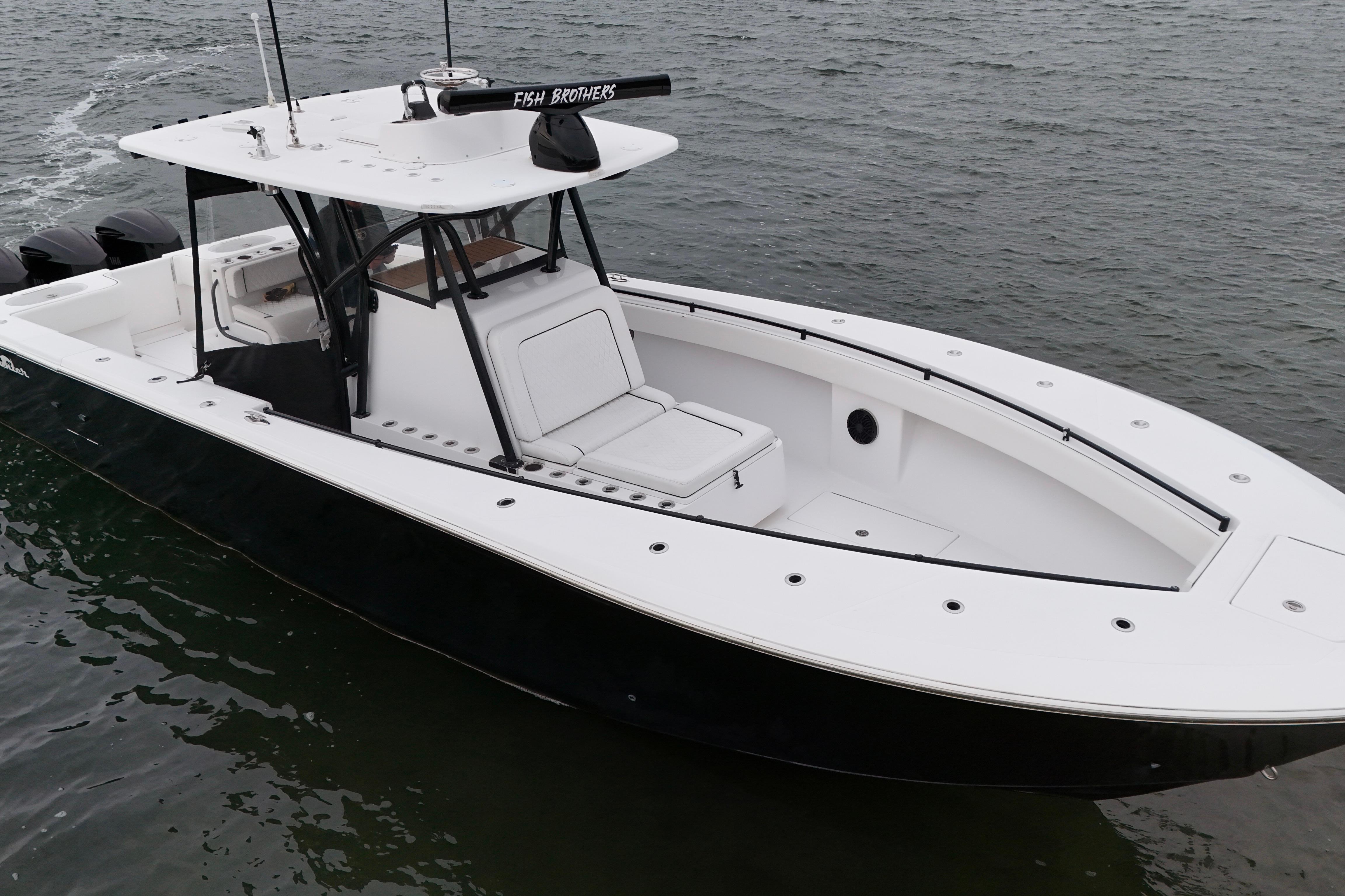2016 Sea Hunter 35 Tournament boat on water, sleek design, spacious deck.