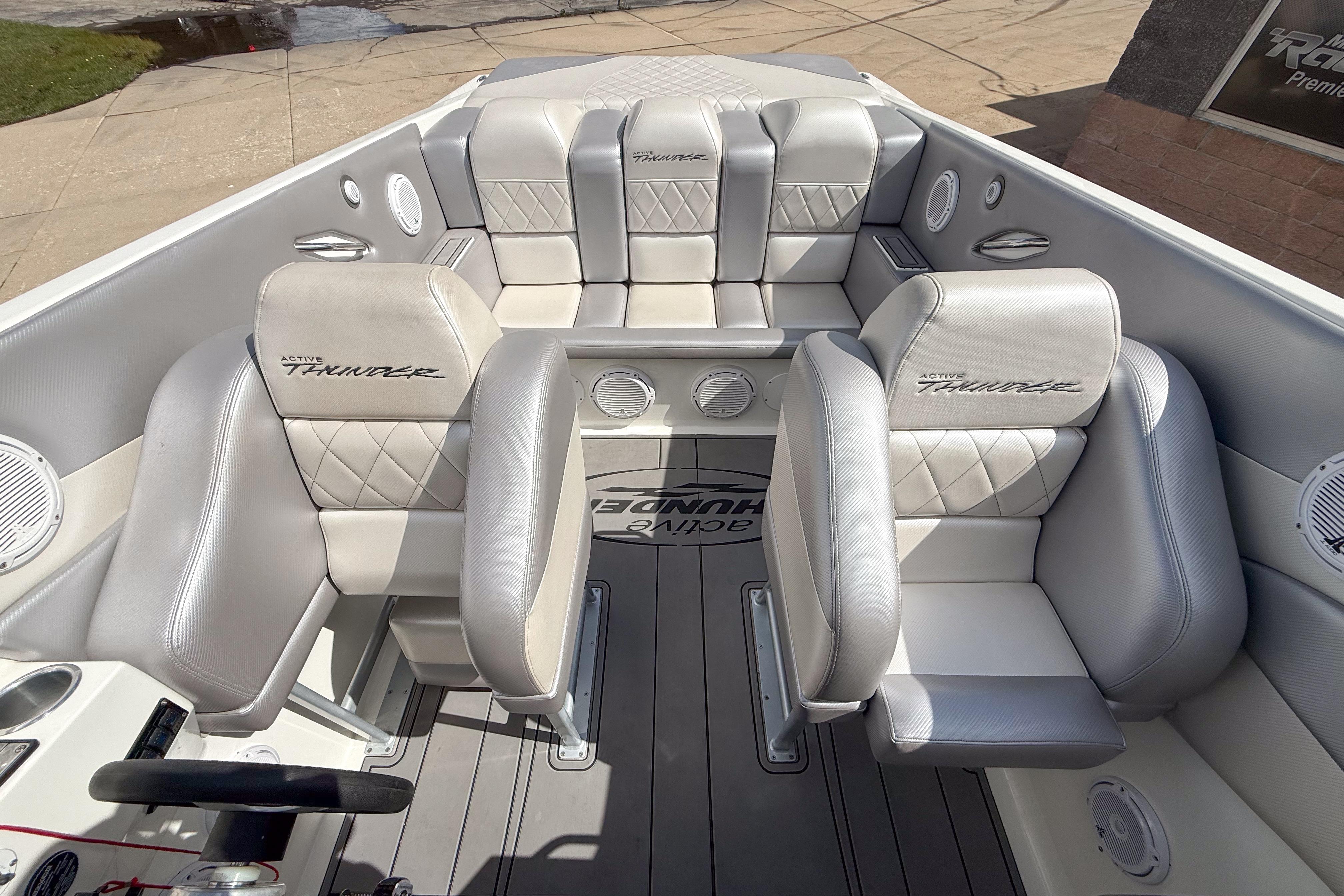 Interior of a 2002 Active Thunder 37 boat with luxurious seating and sleek design.
