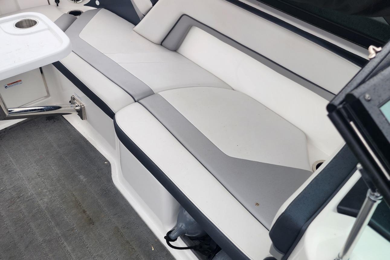 2015 Yamaha Boats 212X interior seating with gray and white upholstery.