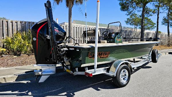 2025 Mako 18 Pro Skiff Backwater Edition on trailer, parked outdoors.