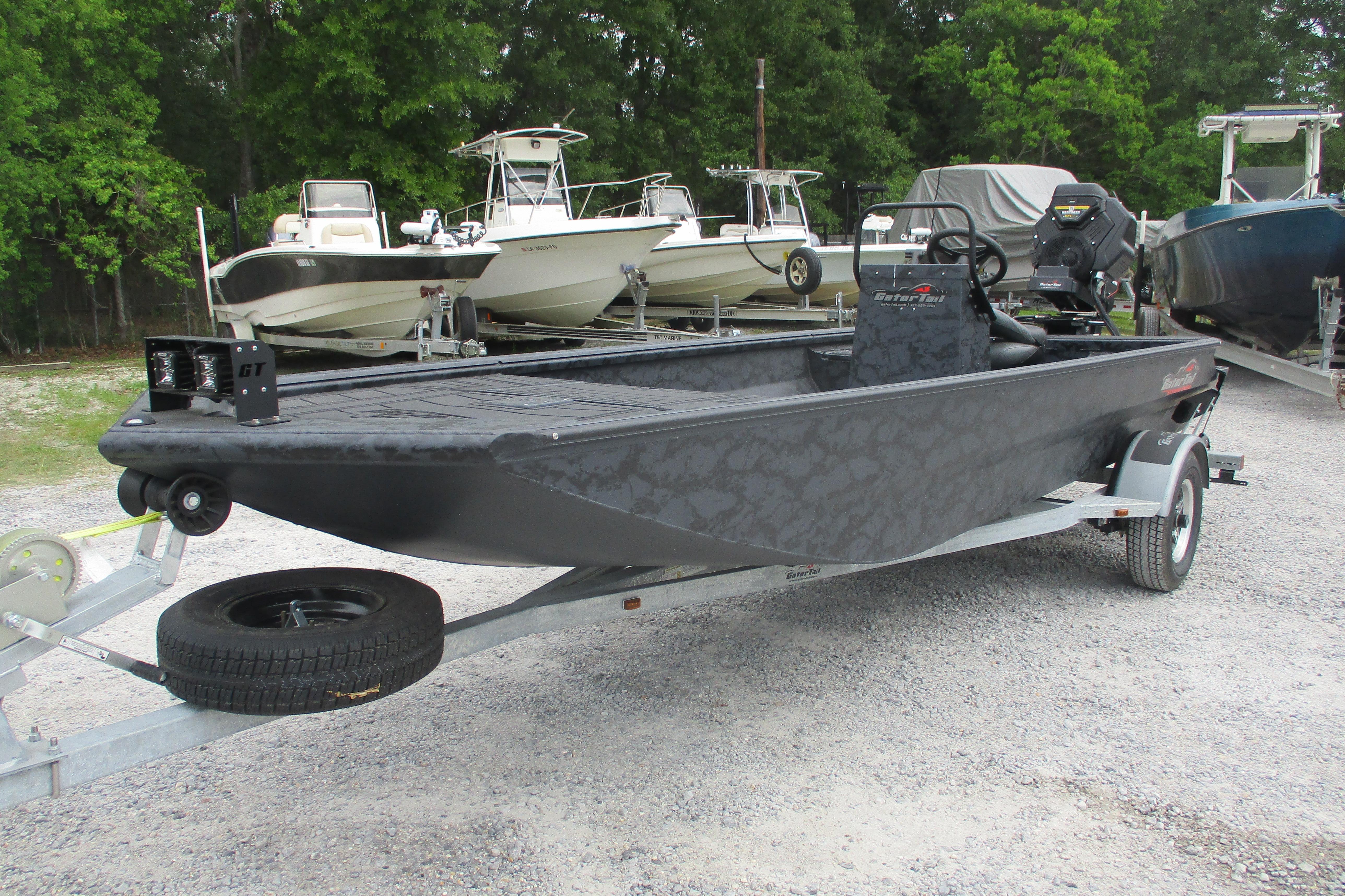 2026 Gator Tail 1860 Extreme CC boat on trailer, parked outdoors.