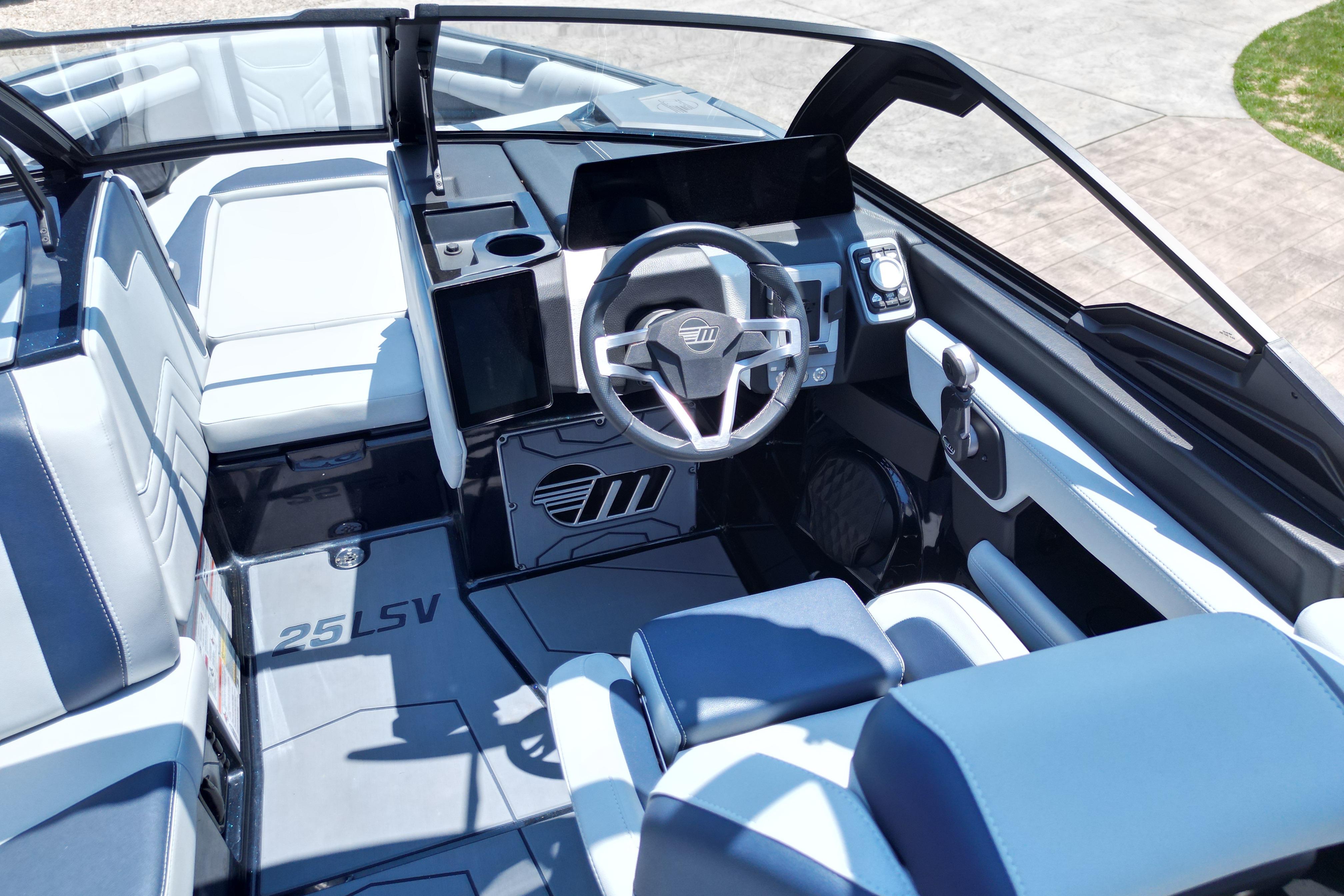 2025 Malibu Wakesetter 25 LSV boat interior with modern dashboard and seating.