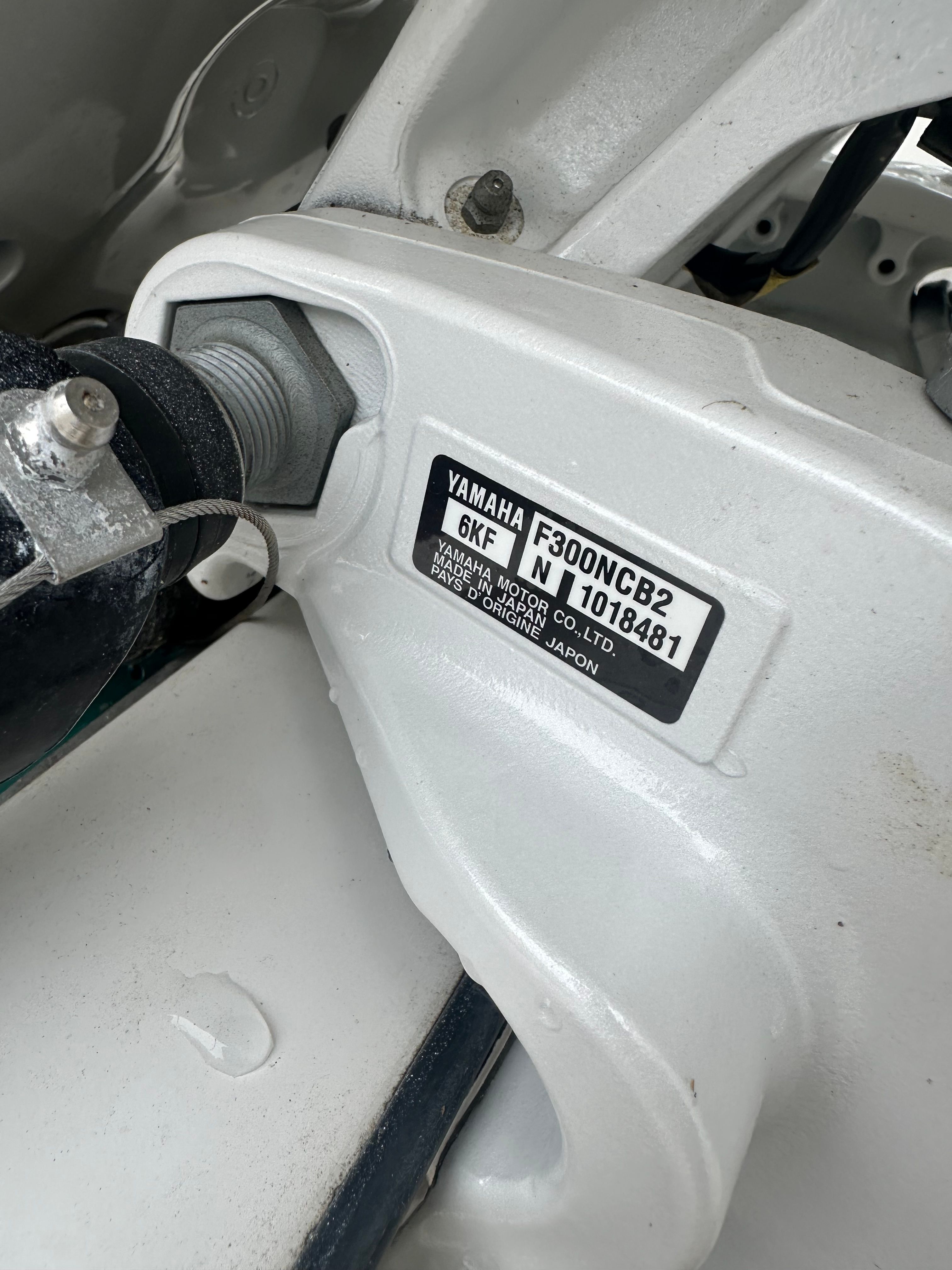 Close-up of a Yamaha engine part with serial number.