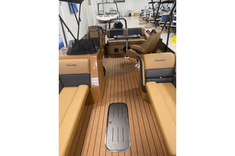 2026 Bentley Pontoons Elite 223 Swingback interior with luxurious seating and wood-style flooring.