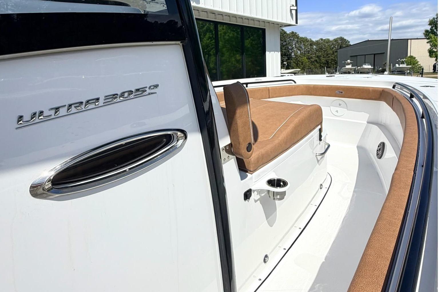Sea Hunt Ultra 305 Coffin Box 2026 with brown upholstery.