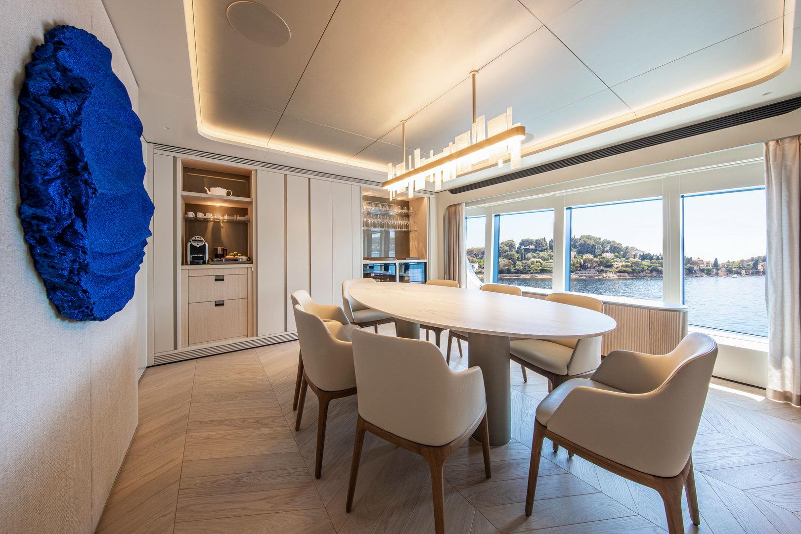 Luxurious dining area on 2021 Van der Valk Custom 34M Explorer yacht with scenic ocean view.