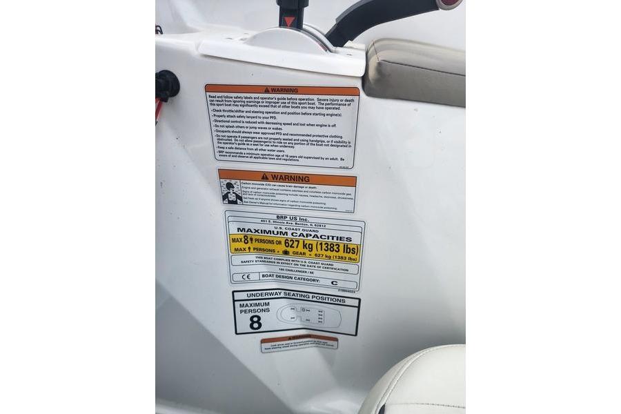 2012 Sea-Doo 180 Challenger warning labels and capacity information, maximum 8 persons, 627 kg.