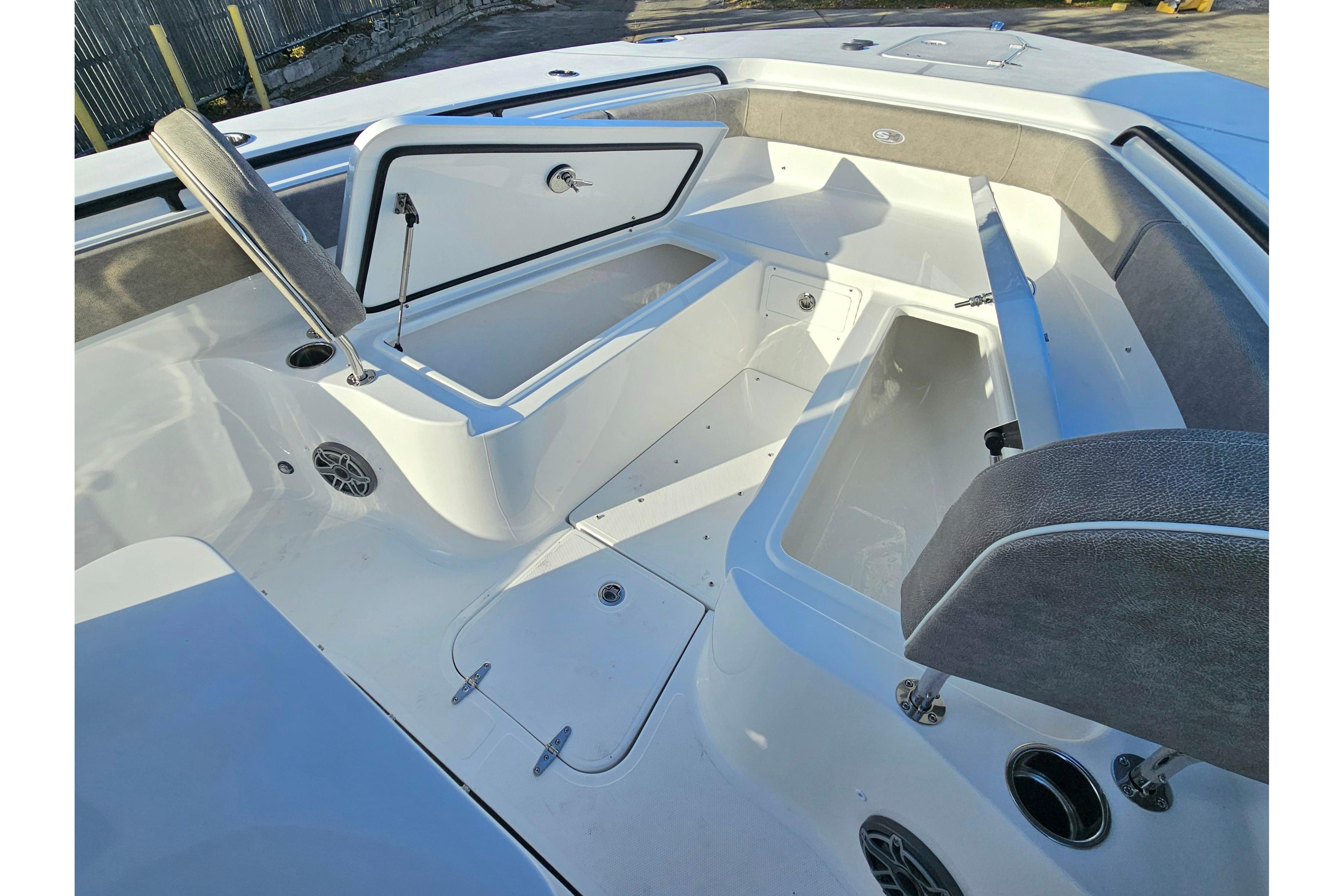 2026 Sea Hunt Ultra 285 SE boat interior with open storage compartments and seating.