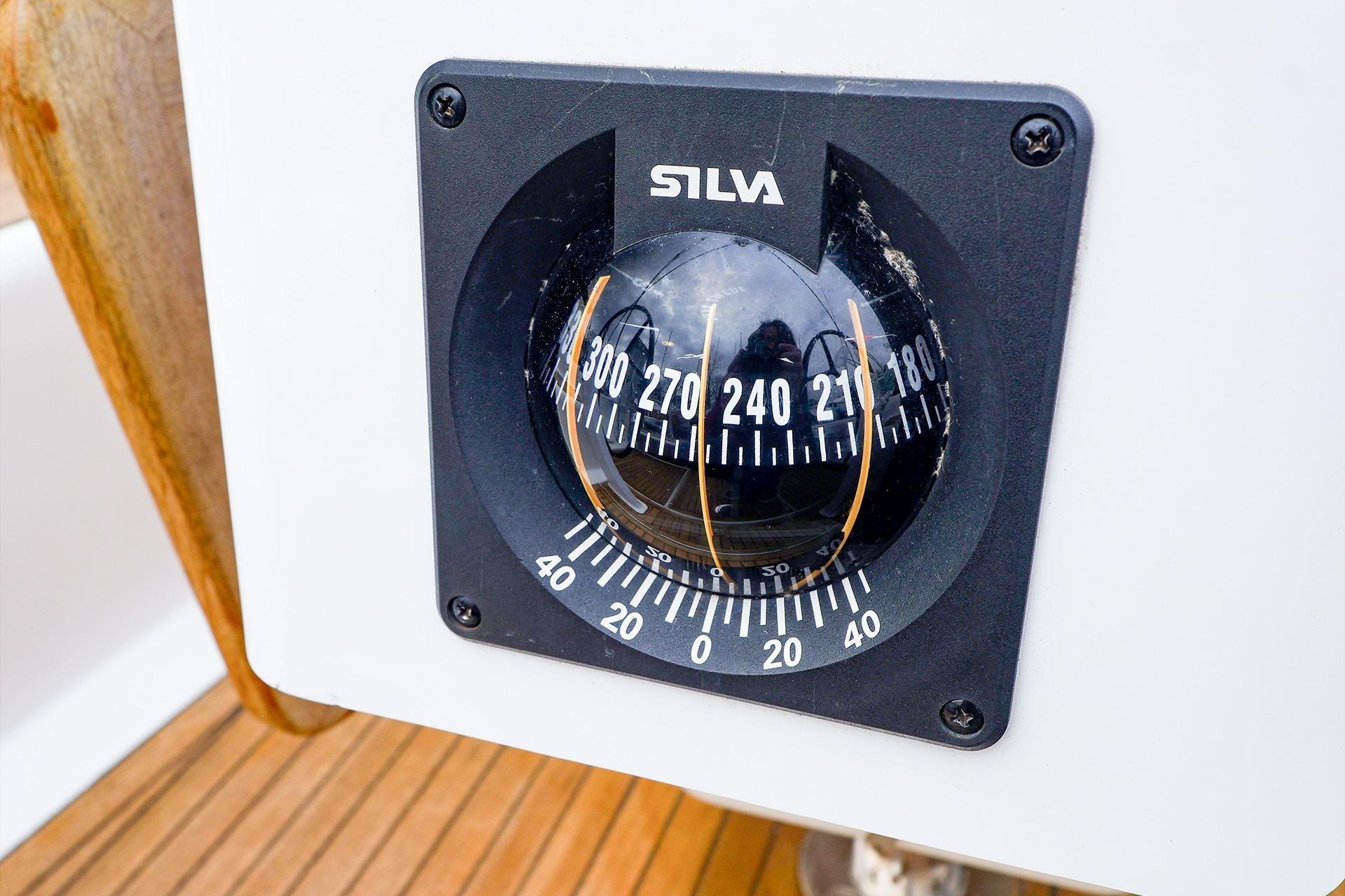 Compass on 2019 Hanse 418 yacht, featuring Silva brand, mounted on wooden deck.