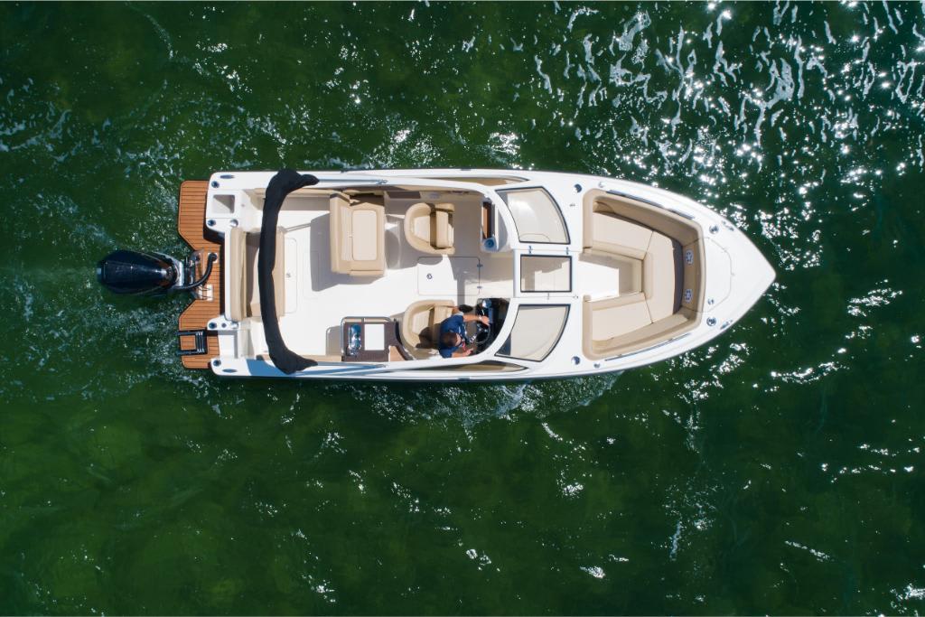 Aerial view of 2023 Scout 240 Dorado boat on green water.