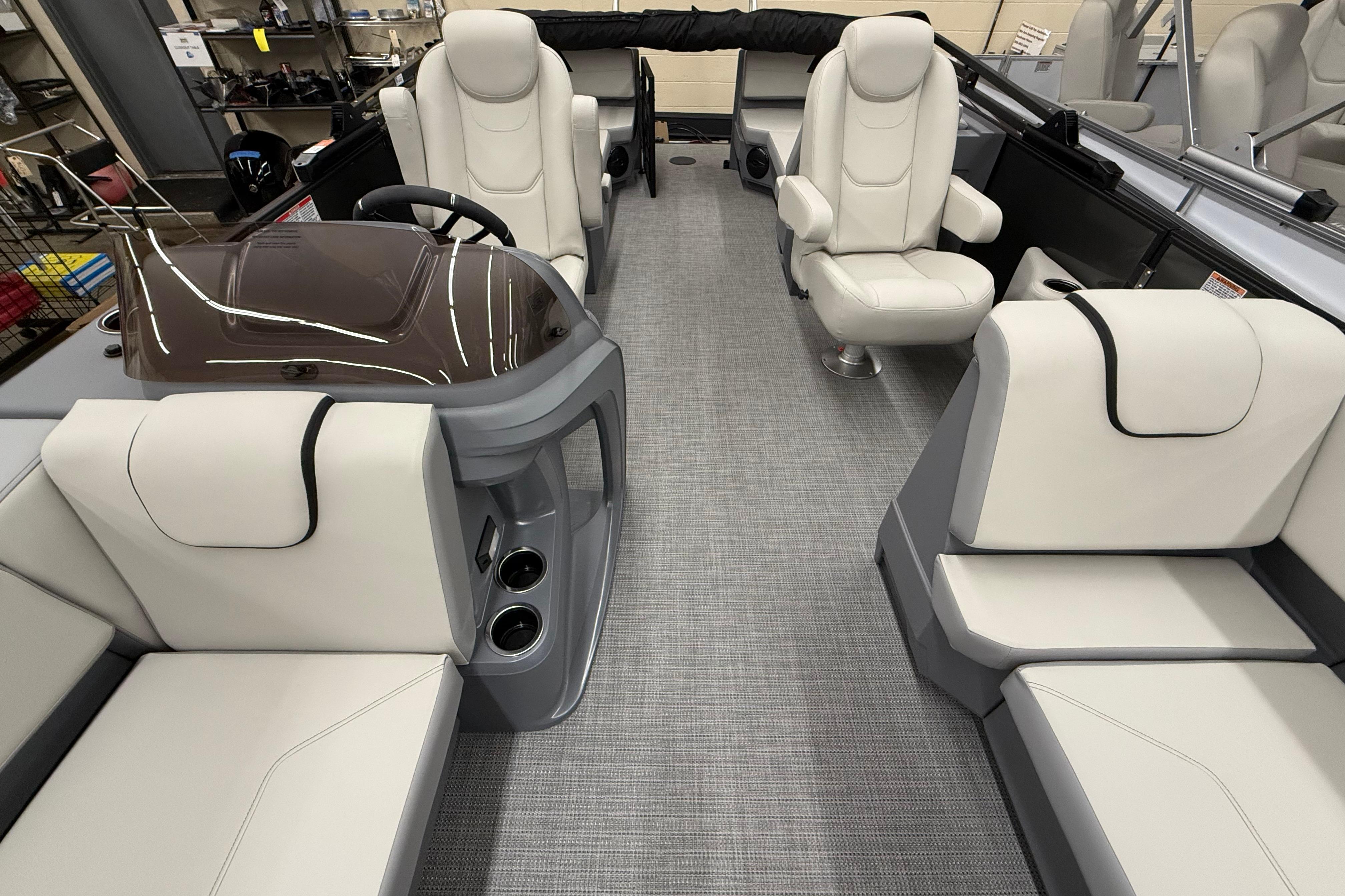 Luxurious interior of 2025 SunChaser Lucerne 22 LR DH pontoon boat with plush seating.