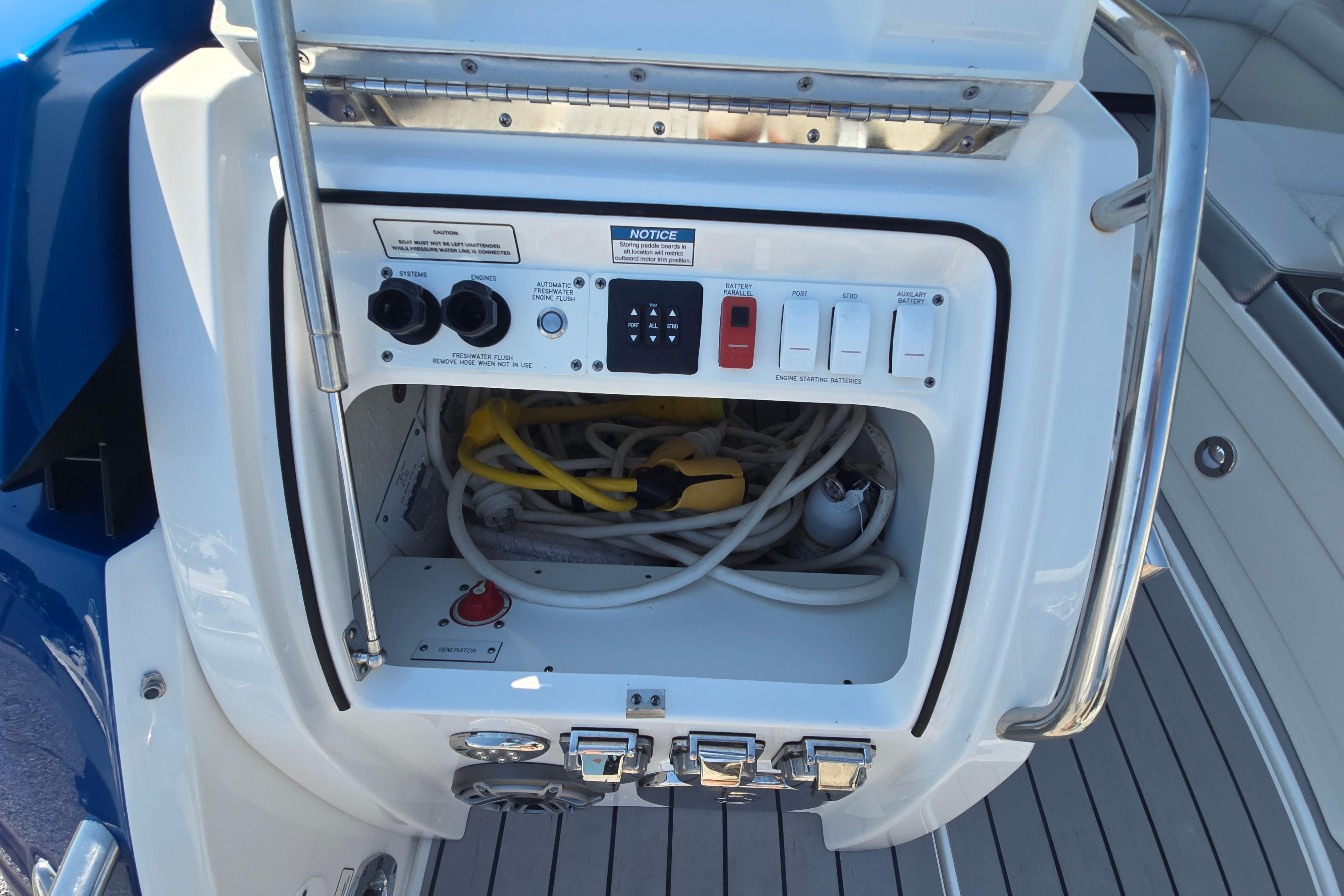 Control panel of 2025 Formula 380 Super Sport Crossover OB boat, featuring switches and wiring.