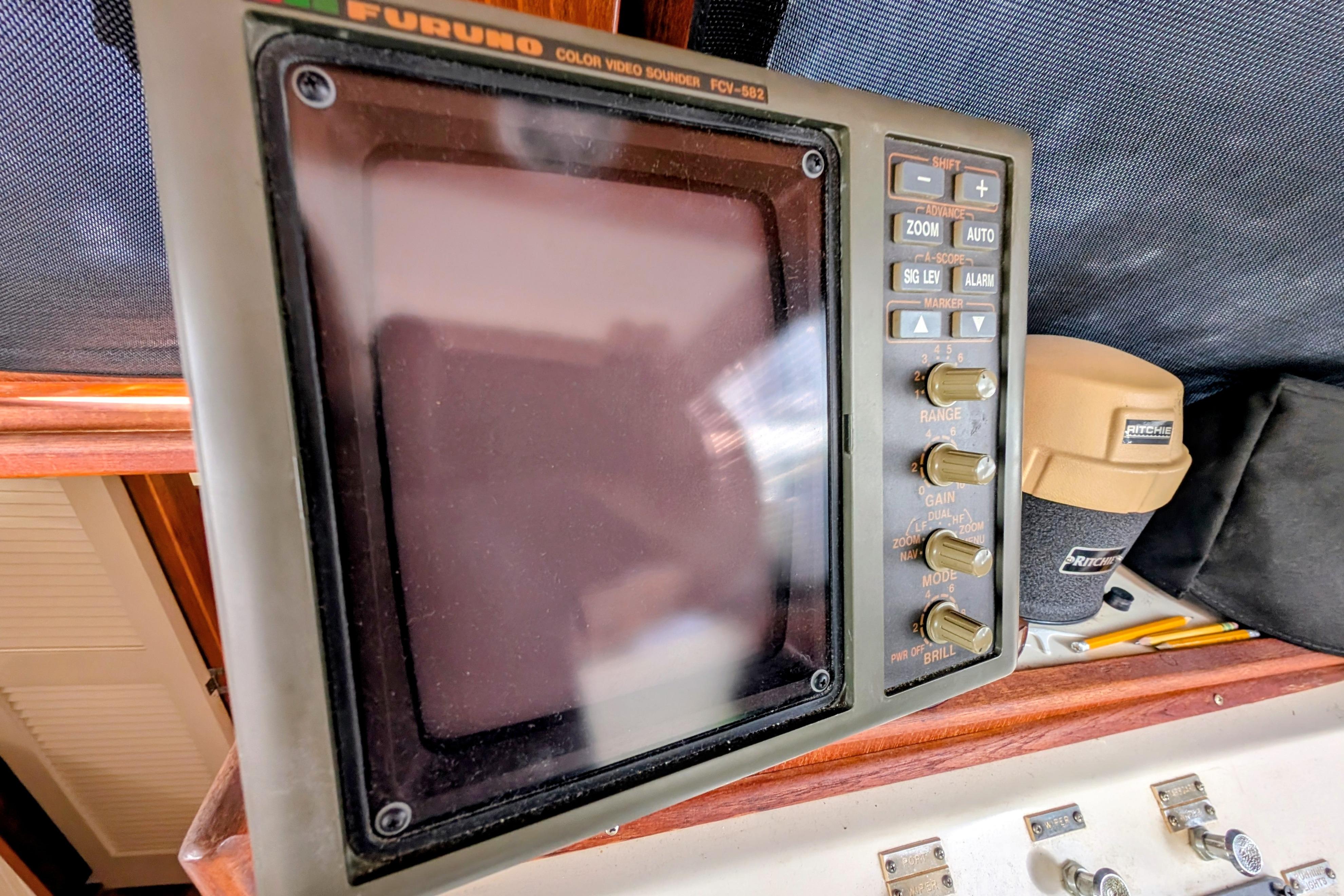 Furuno color video sounder on a 1998 Markley 46 boat dashboard.