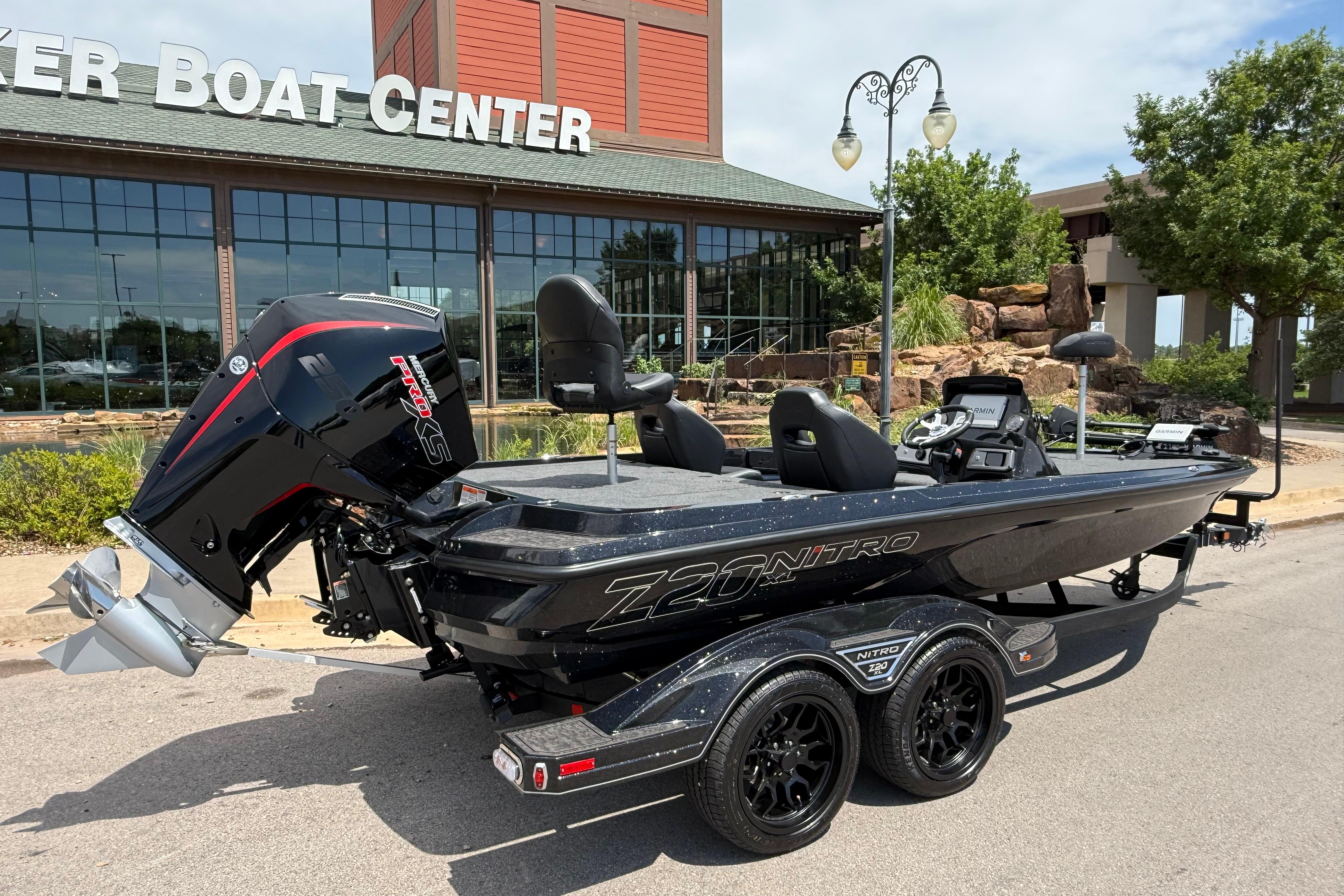 2026 Nitro Z20 XL Pro boat parked outside a boat center, showcasing sleek design and powerful engine.