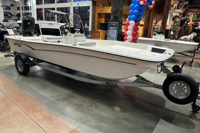 2026 Mako Pro Skiff 17 CC boat displayed indoors on a trailer.