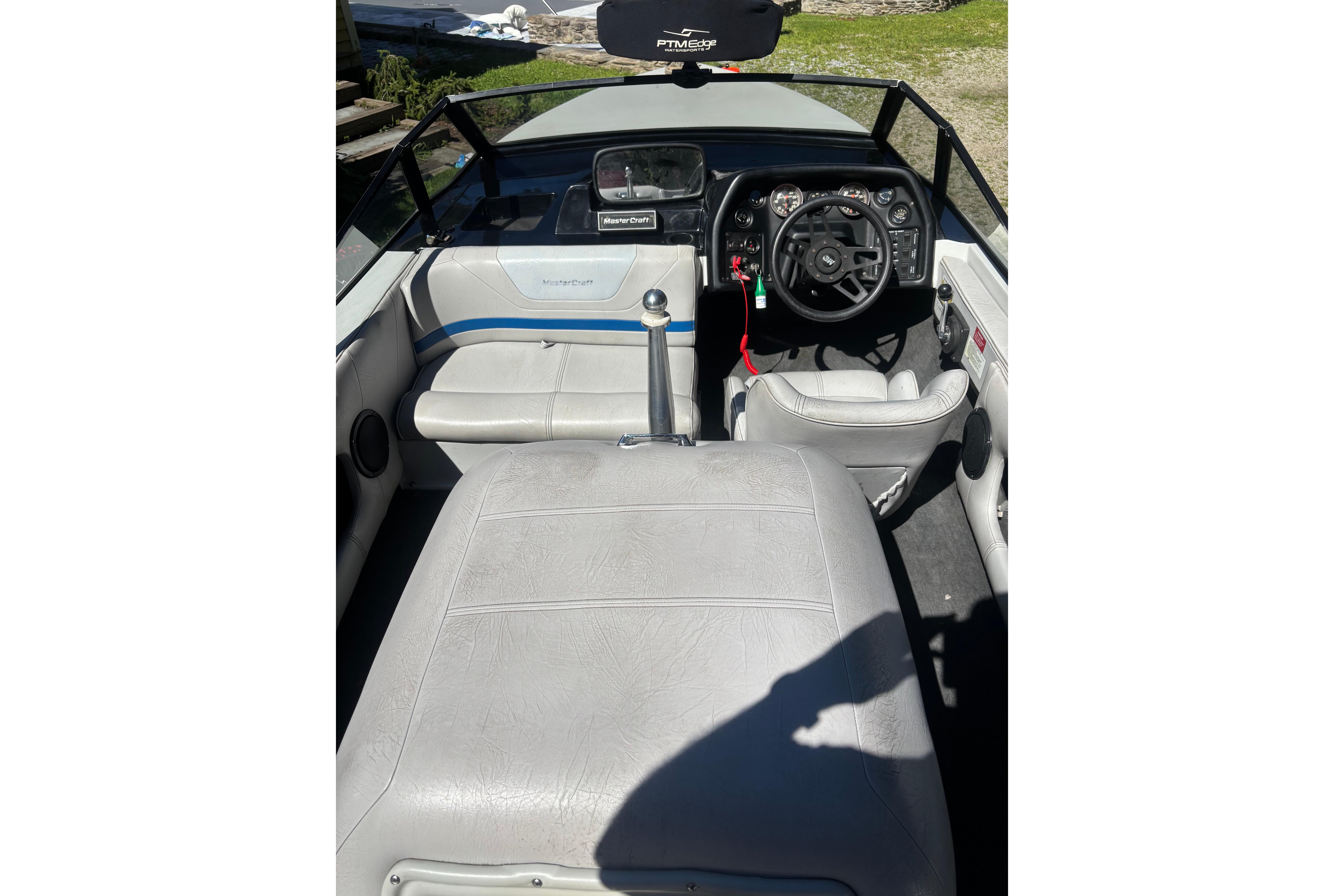 1990 MasterCraft ProStar 190 boat interior with steering wheel and seating.