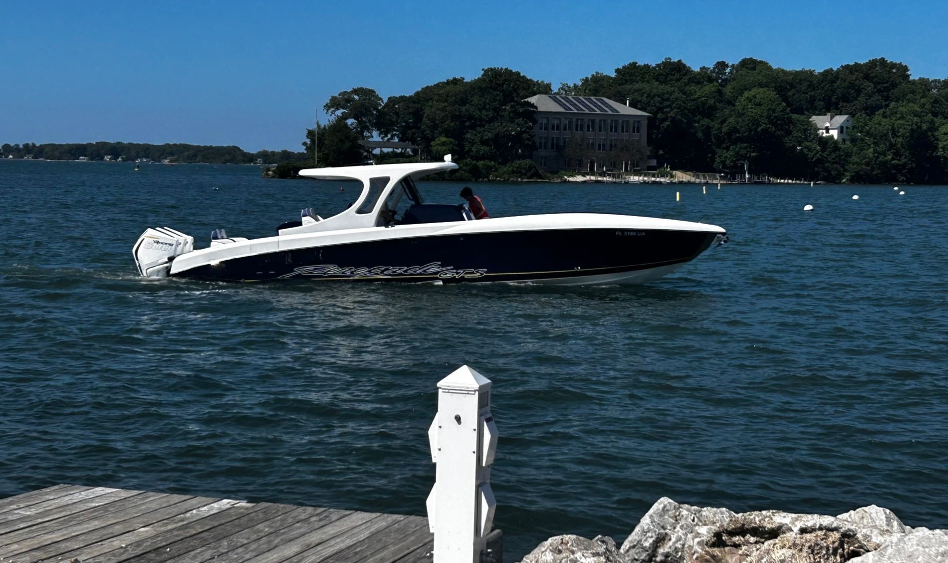 Renegade cc 2026 on calm water near a dock.
