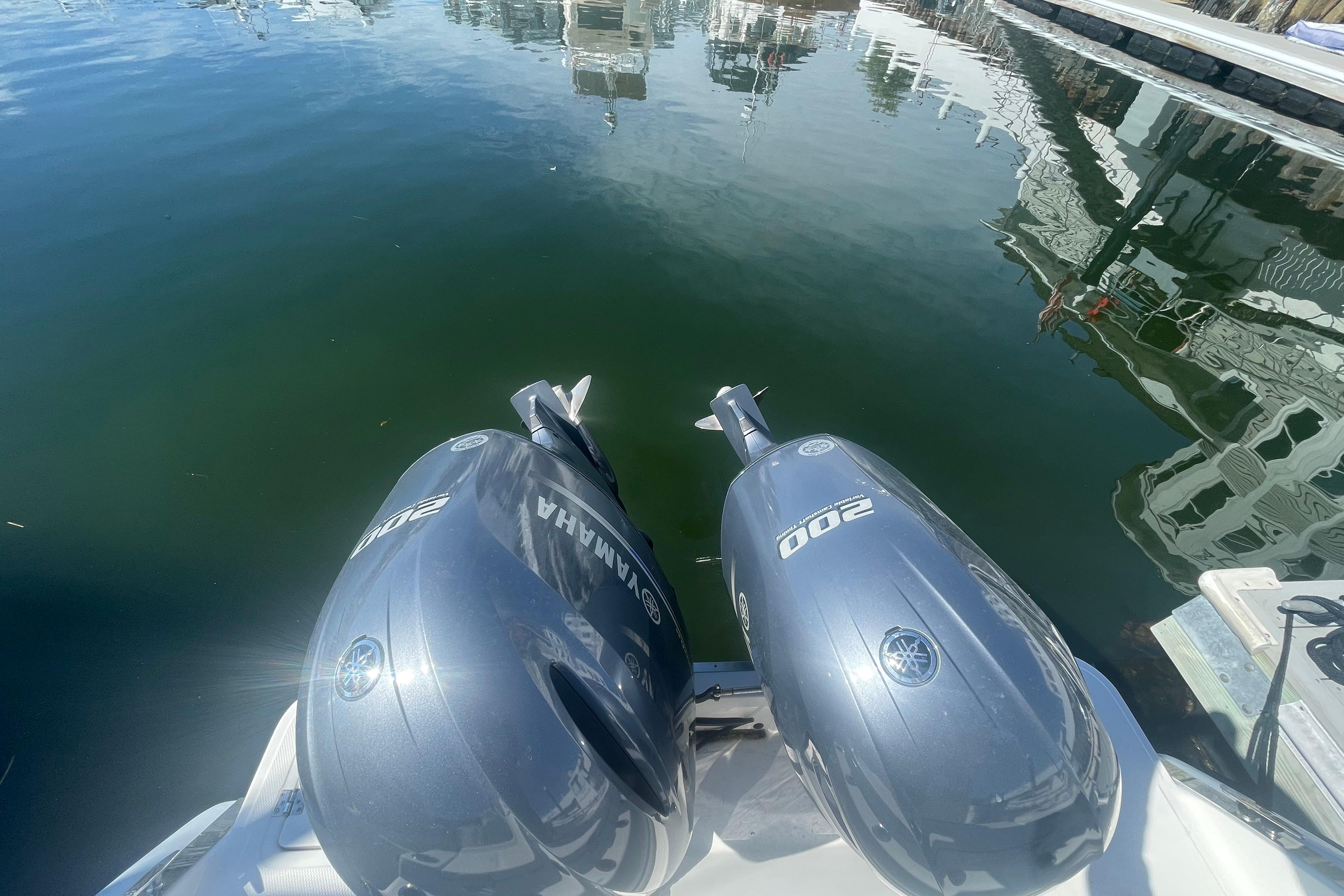 Twin Yamaha 200 engines on a 2023 Robalo R270 Center Console boat at the dock.