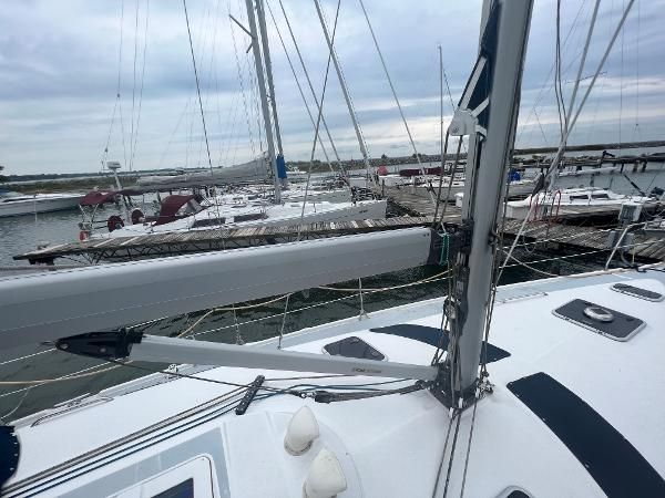 The deck of a 2000 Hunter 410 in a marina, surrounded by other sailboats.