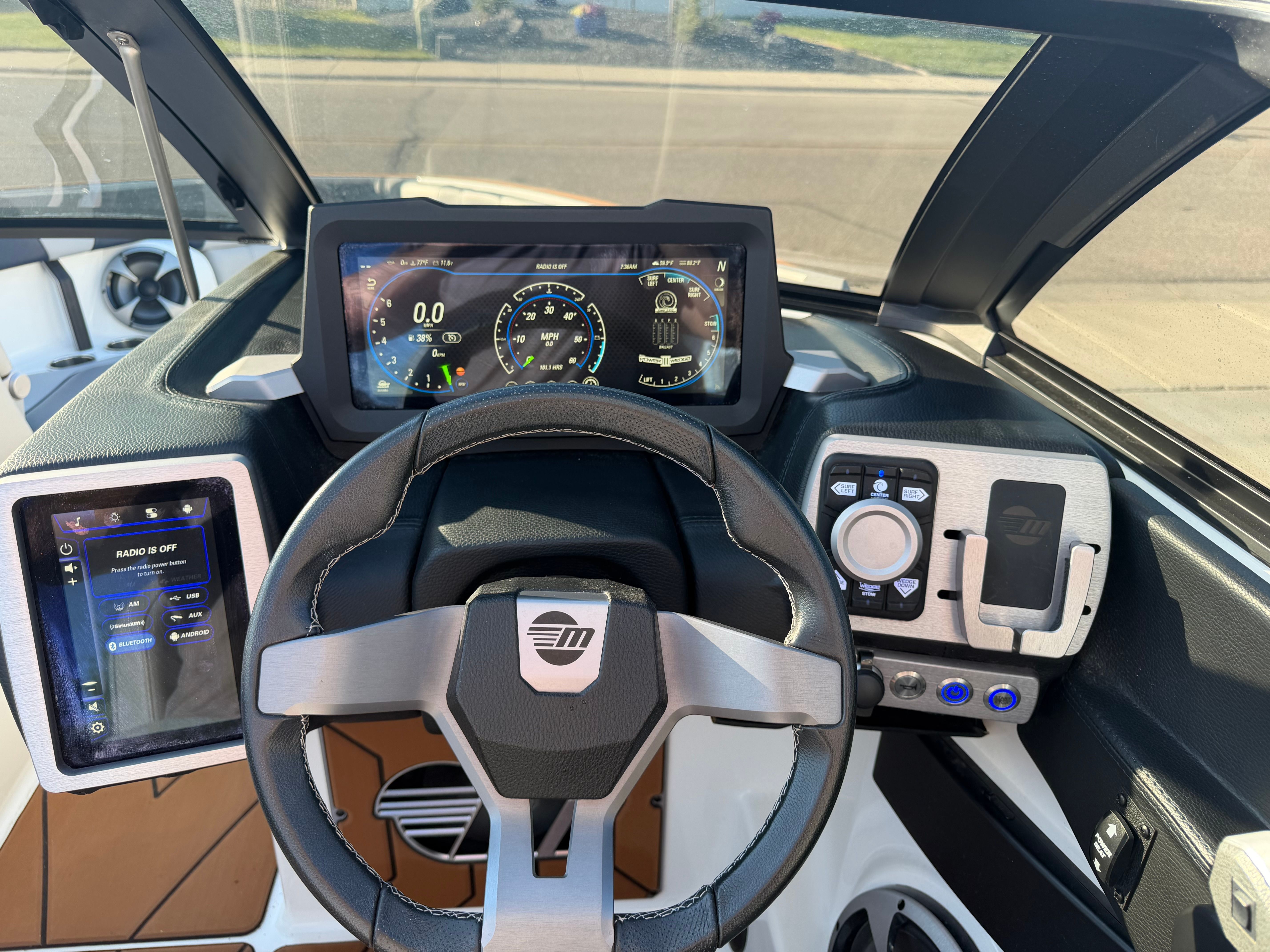 Cockpit of a 2021 Malibu Wakesetter 23 LSV with modern instruments and touchscreen displays.